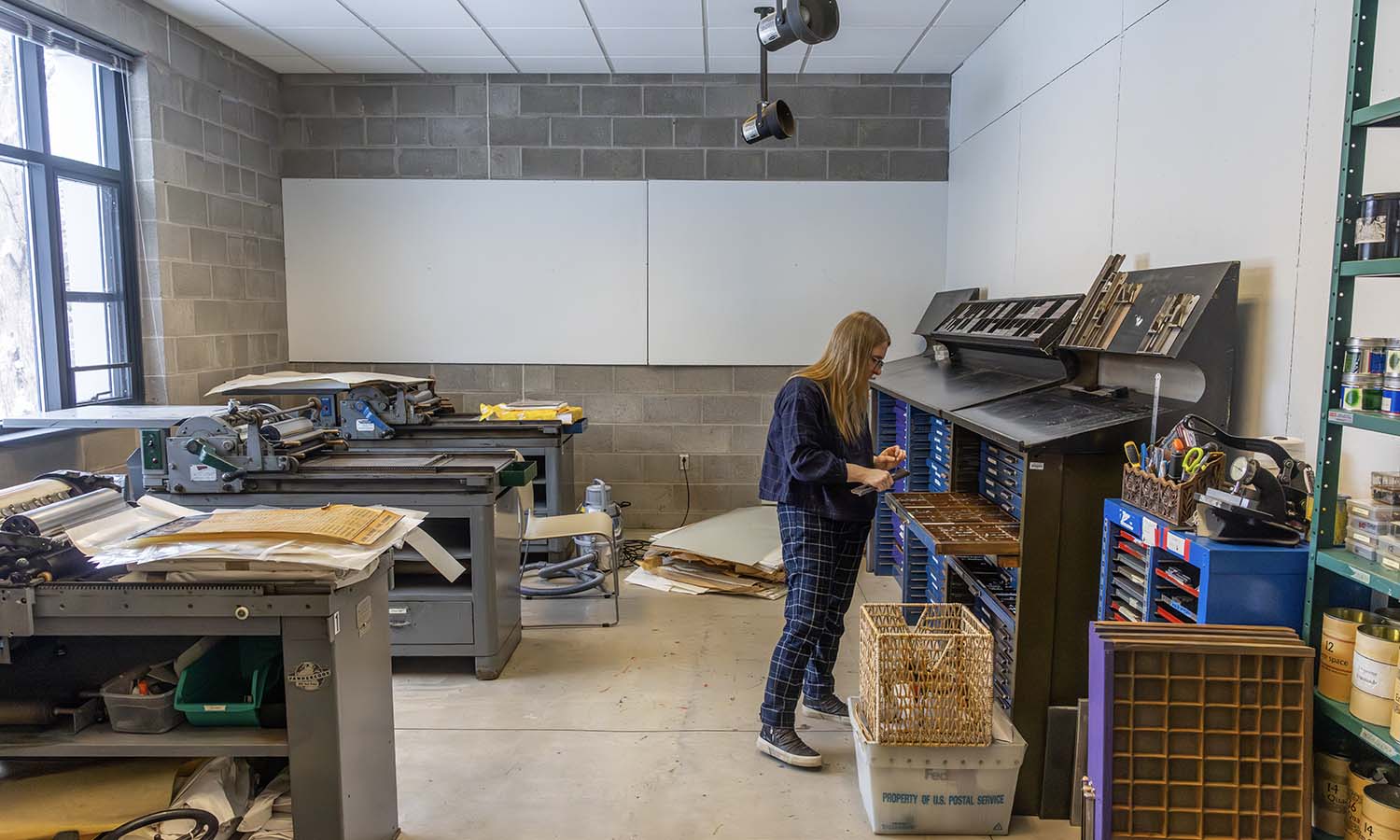 Tasillo unpacks Book Arts materials at the Katherine D. Elliott Studio Arts Center.