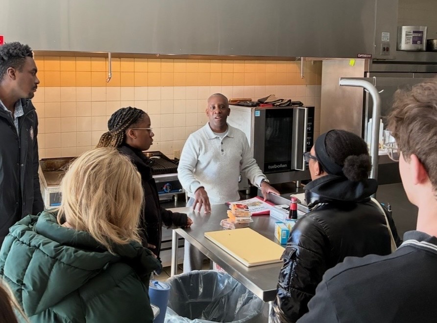 Students visit a teaching kitchen. 