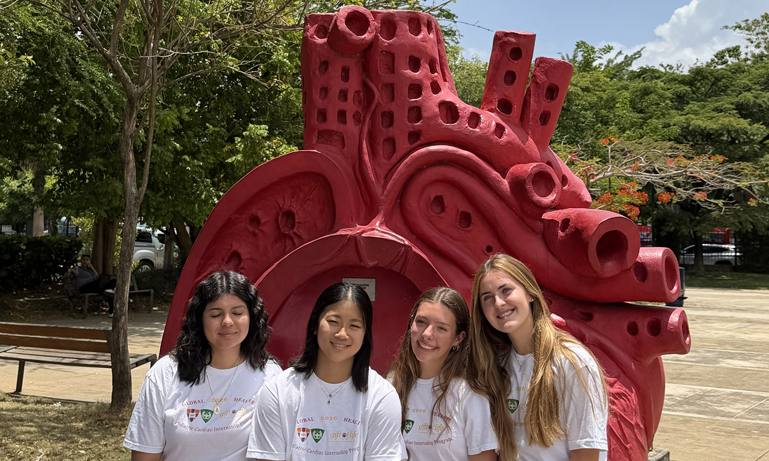 The interns in front of a heart sculpture at CEDIMAT Hospital. 