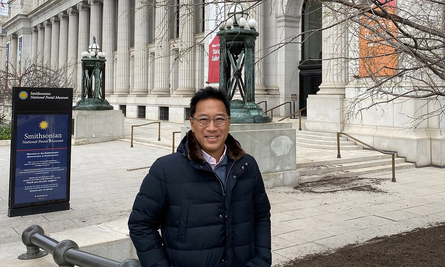 Stephen Wong '89 poses for a photo outside of the Smithsonian National Postal Museum ahead of his Baseball: America's Home Run exhibition.