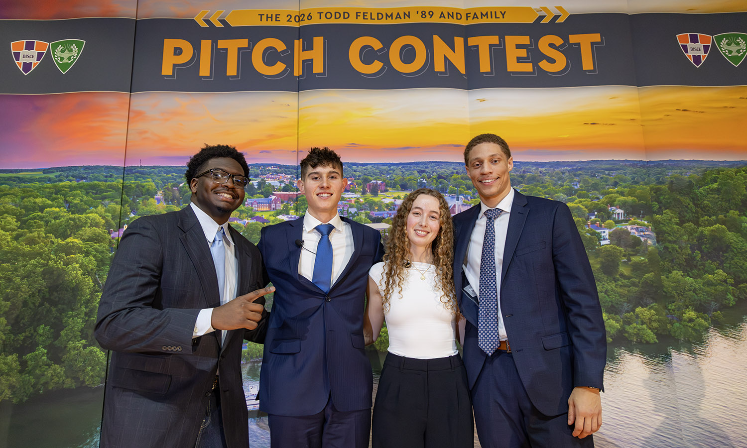 Duke Charles II, Nicholas Jones ’26, Virgina Ritchay ’28 and Tru Styles ’27 gather for a photo on stage.