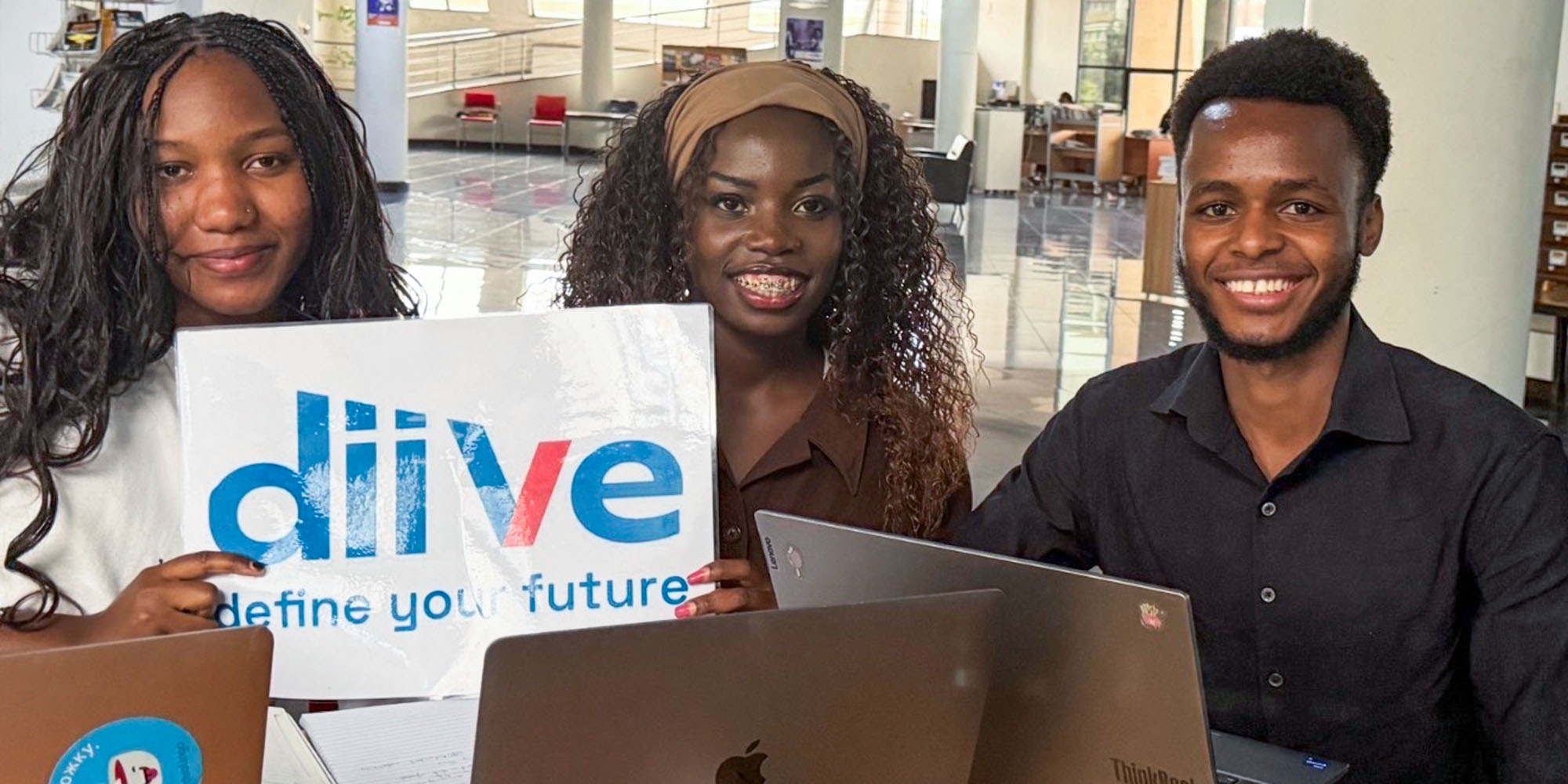 Selina Owino '28 (left) poses with colleagues at DiiVe Consulting