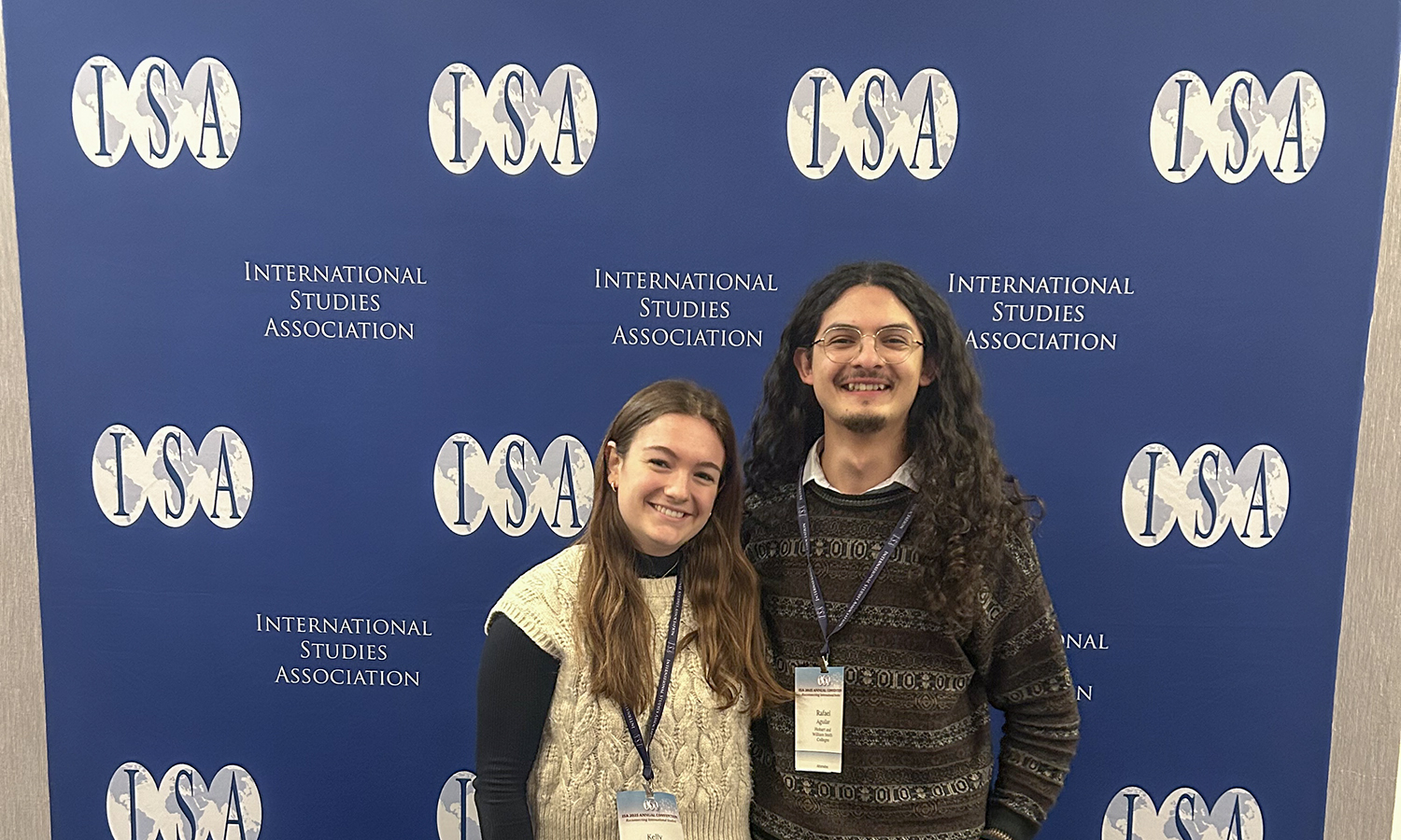 students in front of ISA sign 