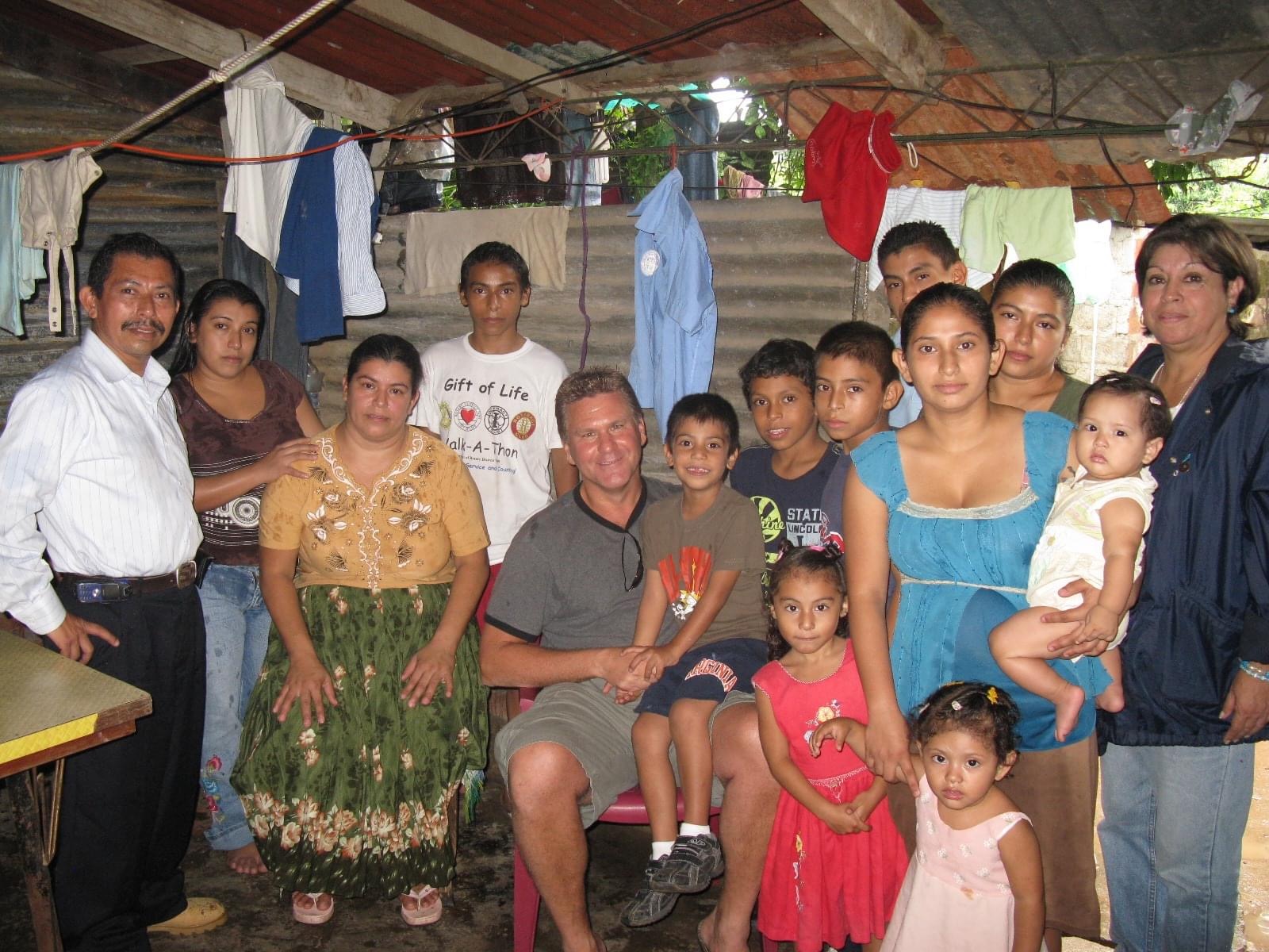 Salvadoran children treated through Gift of Life photographed in their home with family. 