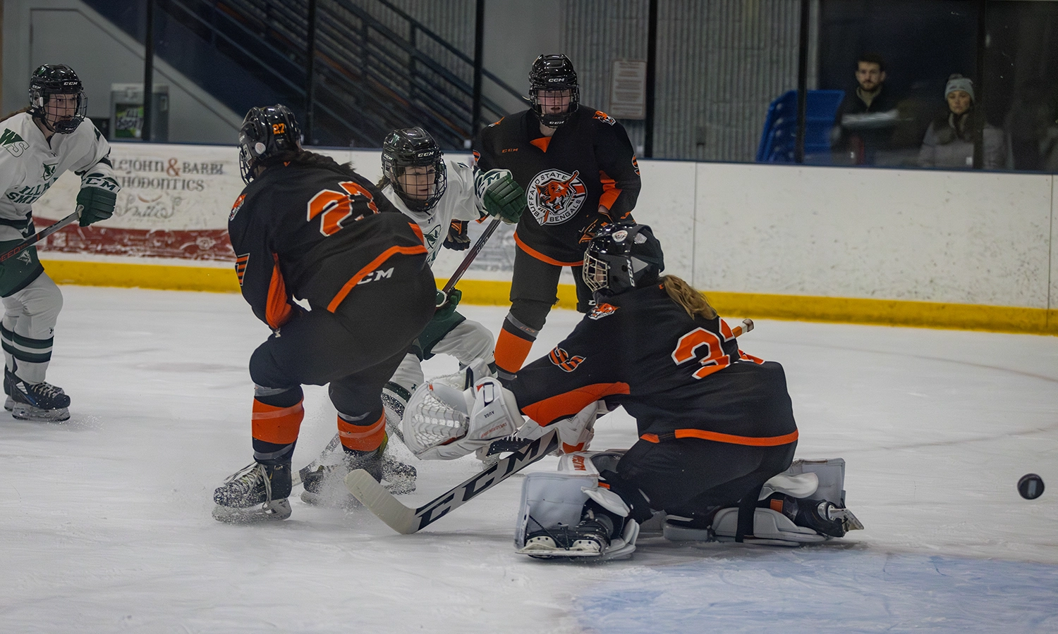Kelly Howe ’26 fires a shot past the Buffalo State goaltender. She scored once in each period for her first collegiate hat trick, leading the Heron hockey team to its eighth straight win.