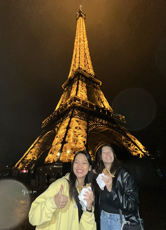 While studying abroad, Van Tran ’25 and Maddie Wasner ’25 visit the Eiffel Tower.