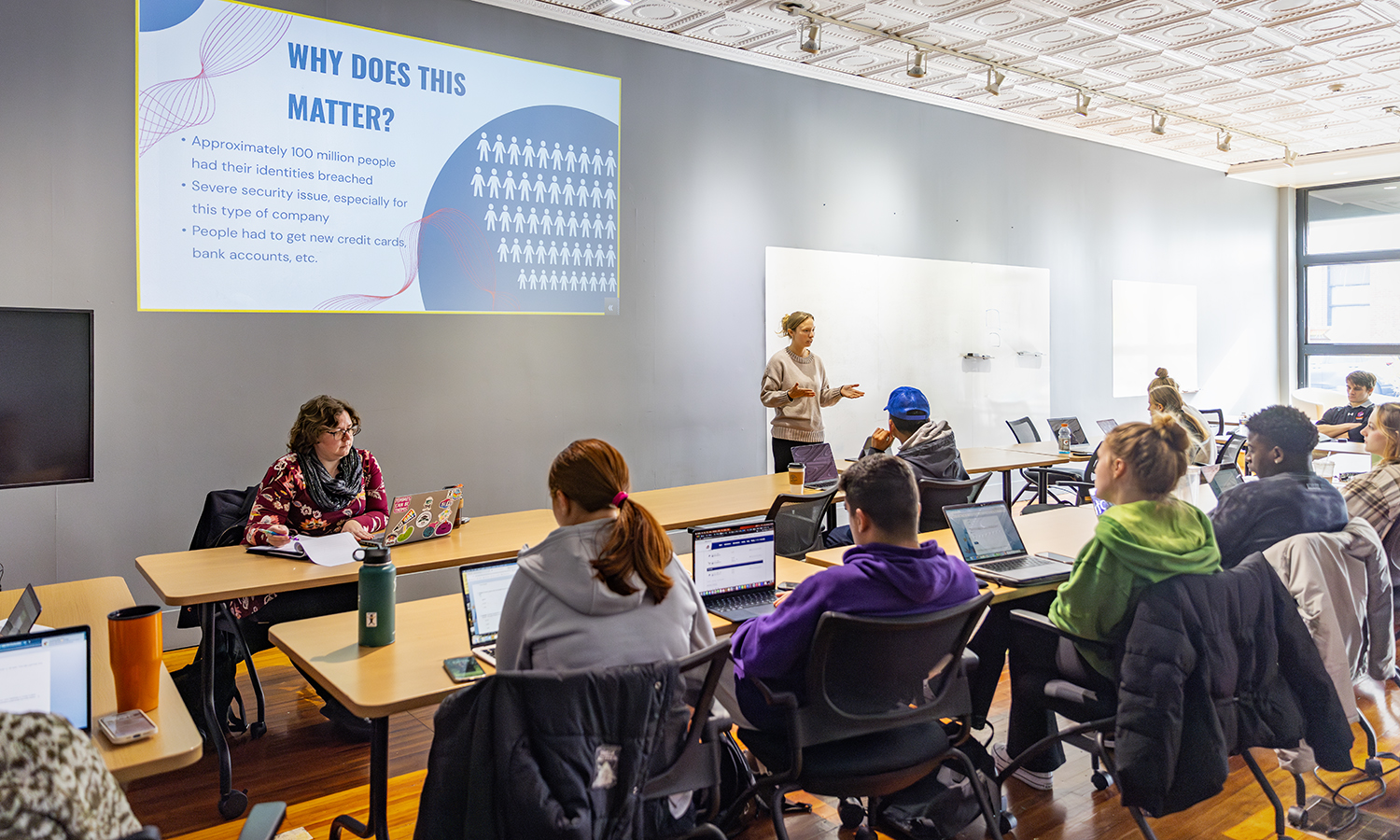 Eliza Wild MSM ’24 gives a presentation during “Data Analytics and Visualization” with LGBTQ+ Resource Center Director Mace McDonald at the Bozzuto Center for Entrepreneurship.