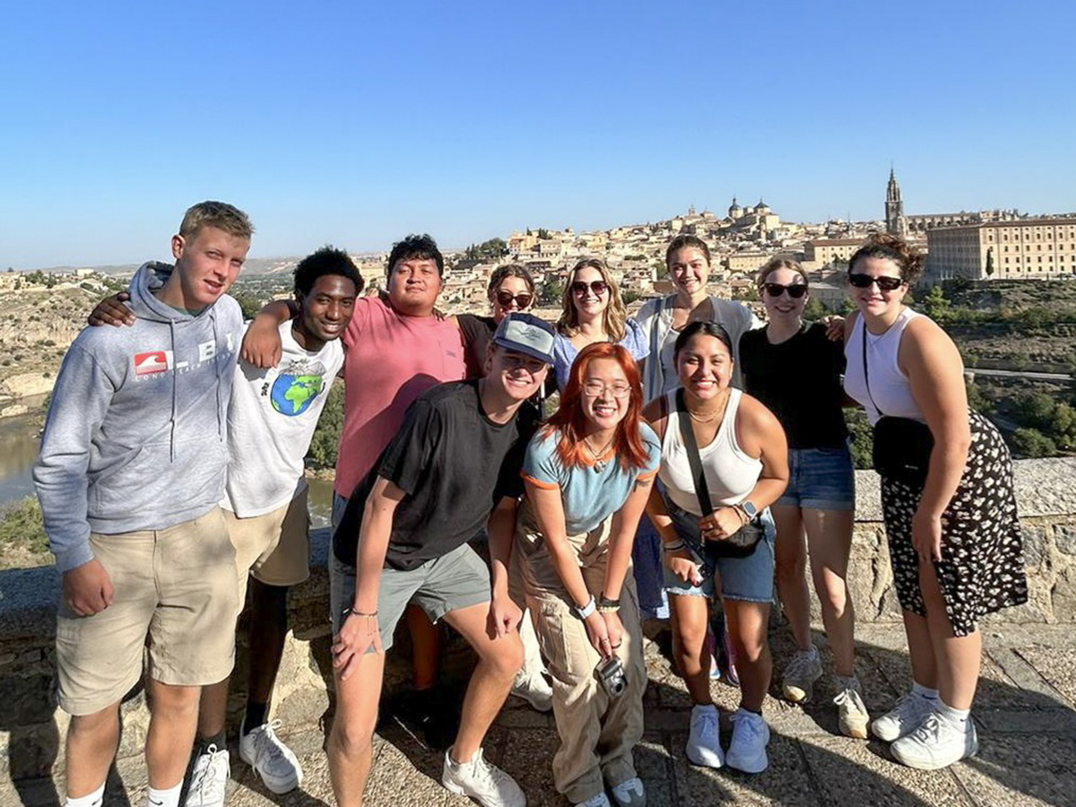 Students studying abroad with Professor of Spanish and Hispanic Studies May Farnsworth gather for a photo outside of Toledo, Spain.