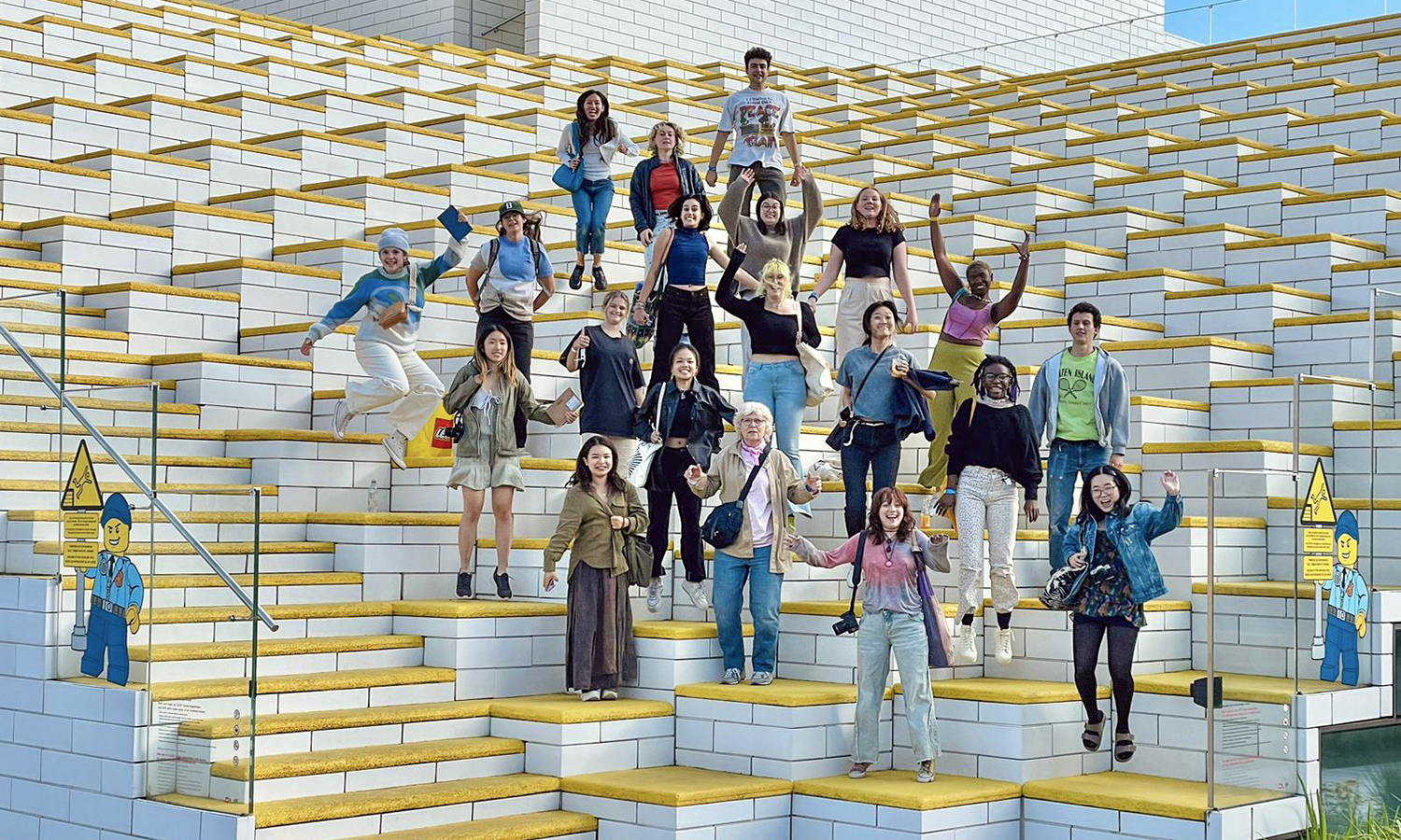 In Billund, Denmark, July Winters ’25 (second row, far right) and students in the DIS Copenhagen program visit Lego House.