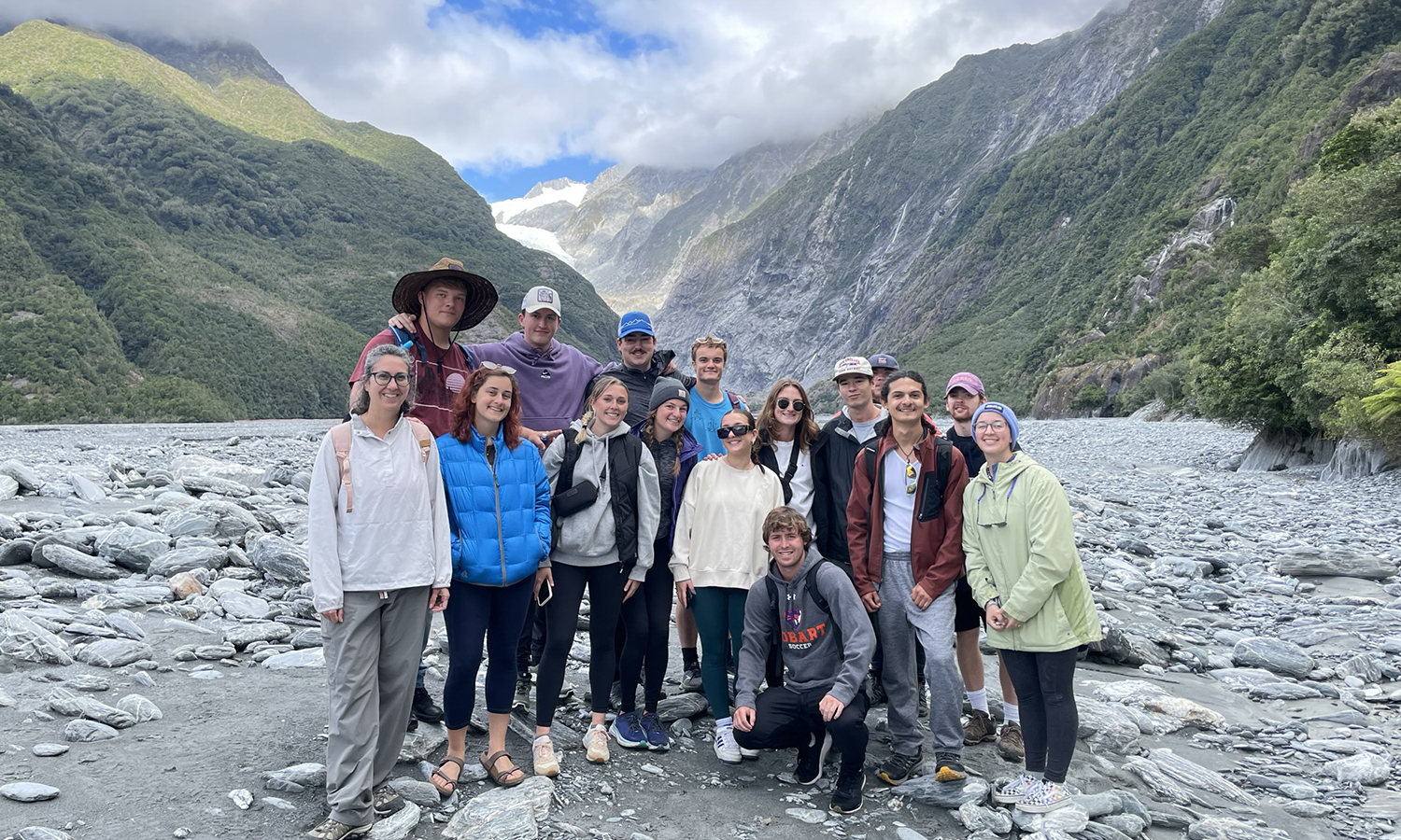 In New Zealand, students studying abroad with Associate Professor of Environmental Studies Whitney Mauer take a group photo at the South Island of Aotearoa.