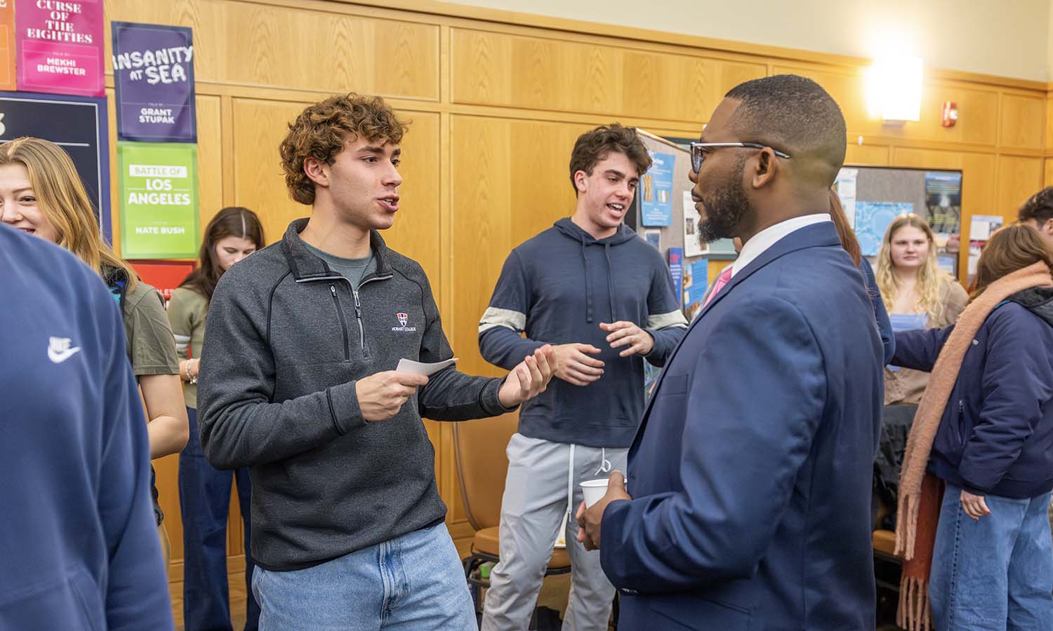 Griffin Harden ’29 speaks to Assistant Dean Kelvin Clark as part of his presentation for “The Reality Effect” with Associate Director of Faculty Enrichment Susan Hess. 