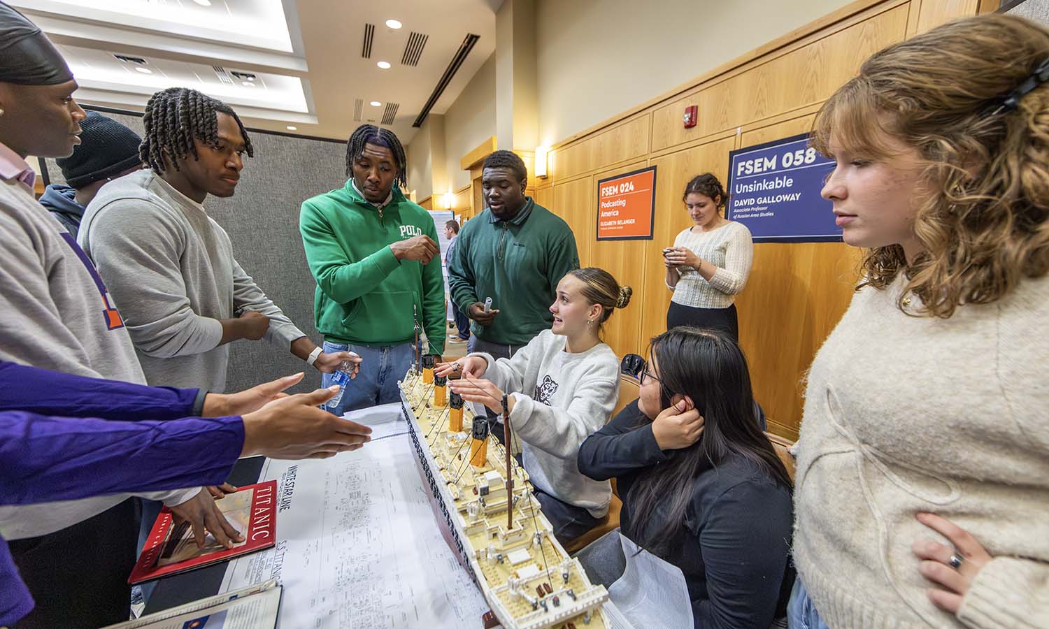 Lilia Mack ’29, Ashley Conde ’29 and Mamie Curran ‘29 speak about their research on The Titanic while in “Unsinkable” with Associate Professor of Russian Area Studies David Galloway. 