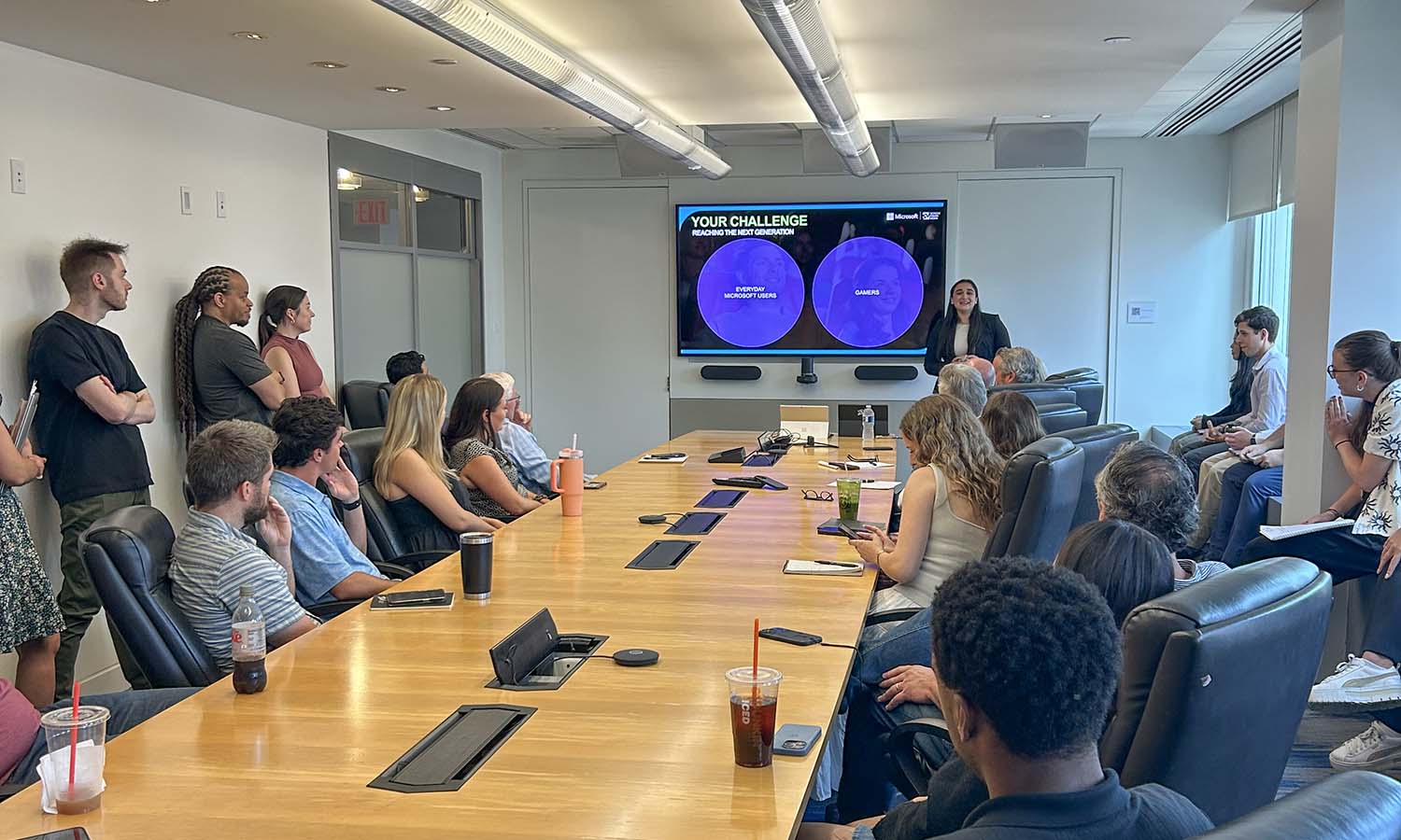 Isa Daniels ’26 presents a sales pitch to her colleagues at Screenvision Media, where she completed an internship. 