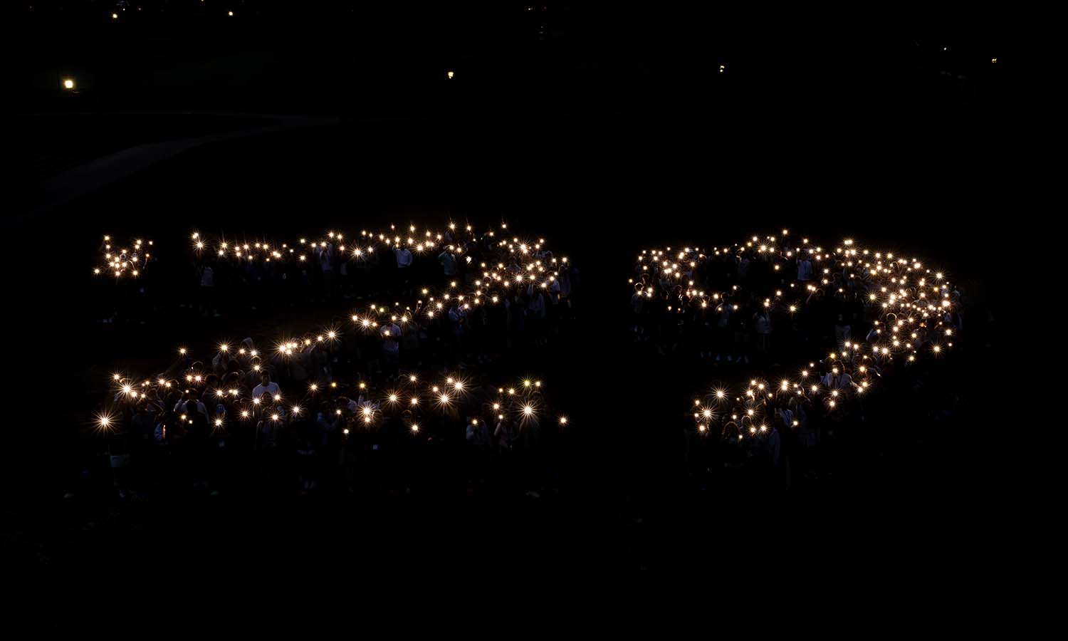 Students gather for Illumination on Bristol Lawn.  