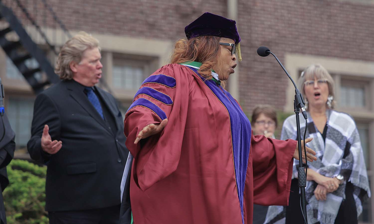 Director of the Martin Luther King Memorial Choir Patrisha Blue ’77, L.H.D.’25 performs The Battle Hymn of the Republic after receiving an Honorary Degree at Commencement. 