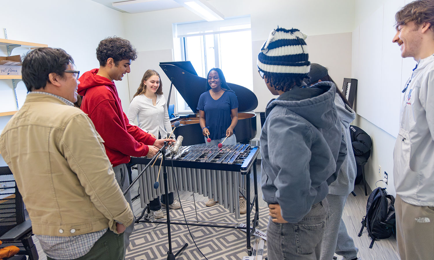 Students learn microphone placement and audio capture methods during "Introduction to Music Production and Recording" with Instructor Dennis Mariano in a third-floor music room of the Gearan Performing Arts Center. The room is named in honor of Andreanna A. Doering ’84. 