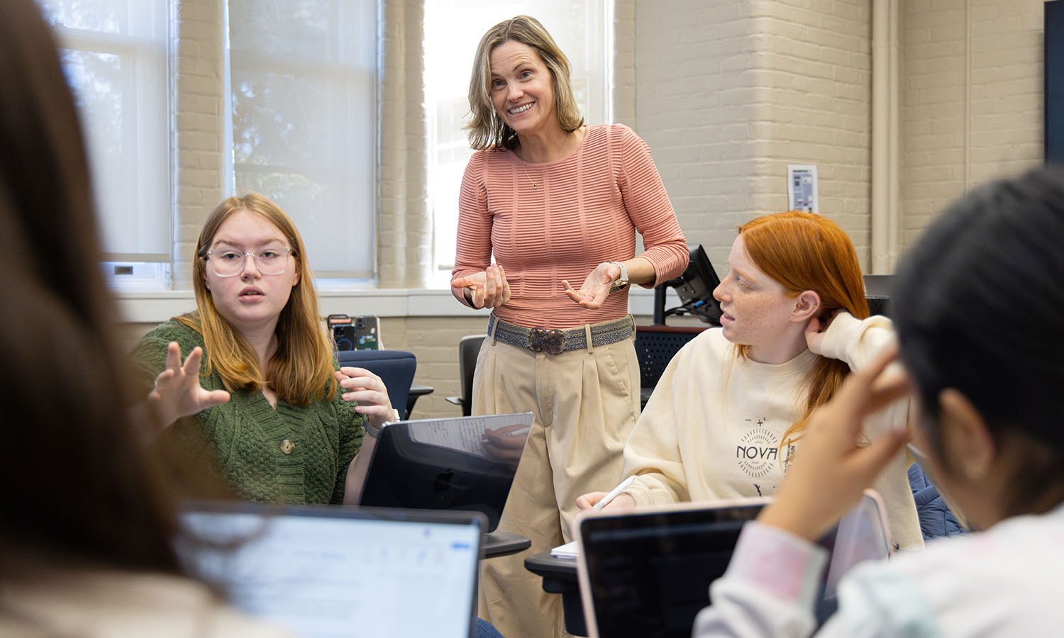 Professor of Spanish and Hispanic Studies Carolina Travalia helps students prepare for a mock debate in "Spanish for Conversation and Debate."  