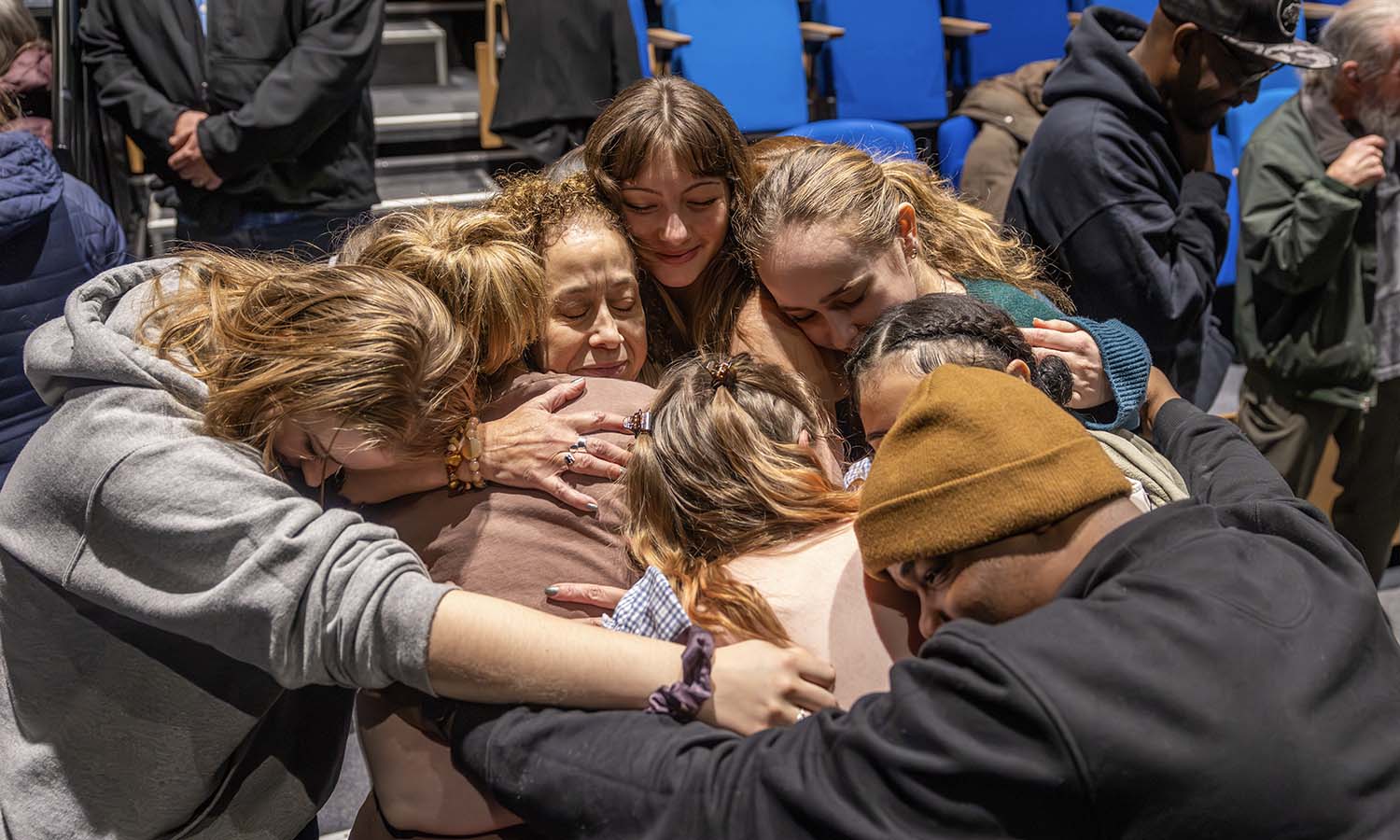 A member of the HWS faculty since 1990, retiring Professor of Dance and Movement Studies Donna Davenport is surrounded by fellow faculty, staff and students after teaching her last class. 