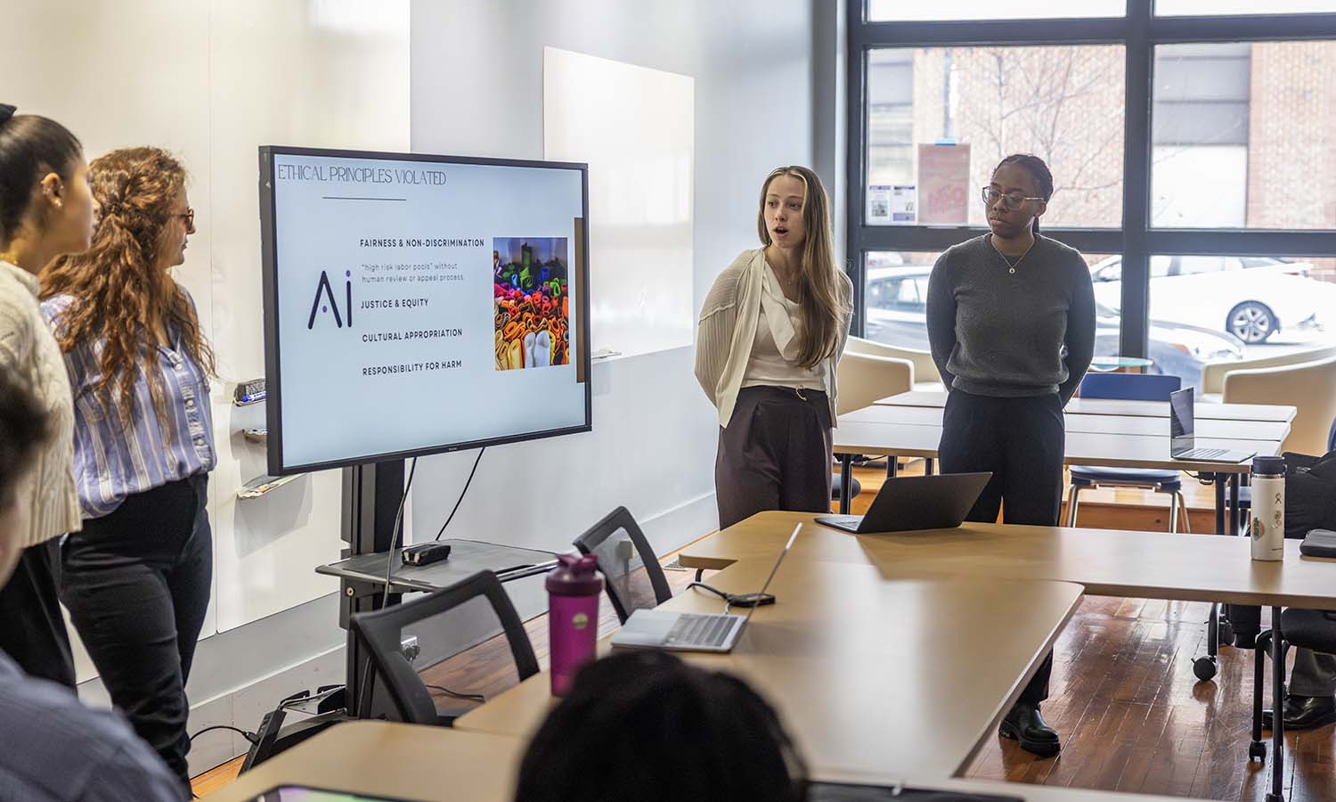 Casey Fiore MSM’26, Amarya Weinberger MHEL’26, Estelle Bignet ’25, MSM’26 and Jada Smith-Padmore ‘24, MSM’26 complete their final presentation for “Management Strategies” with Associate Professor of Business Management and Entrepreneurship Craig Talmage. 
