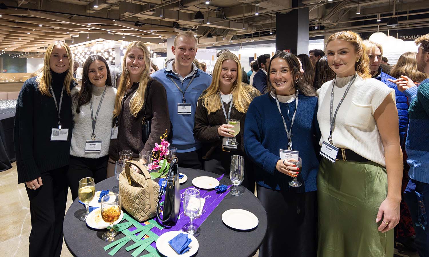Recent graduates pose for a photo at the Boston Holiday Reception. 