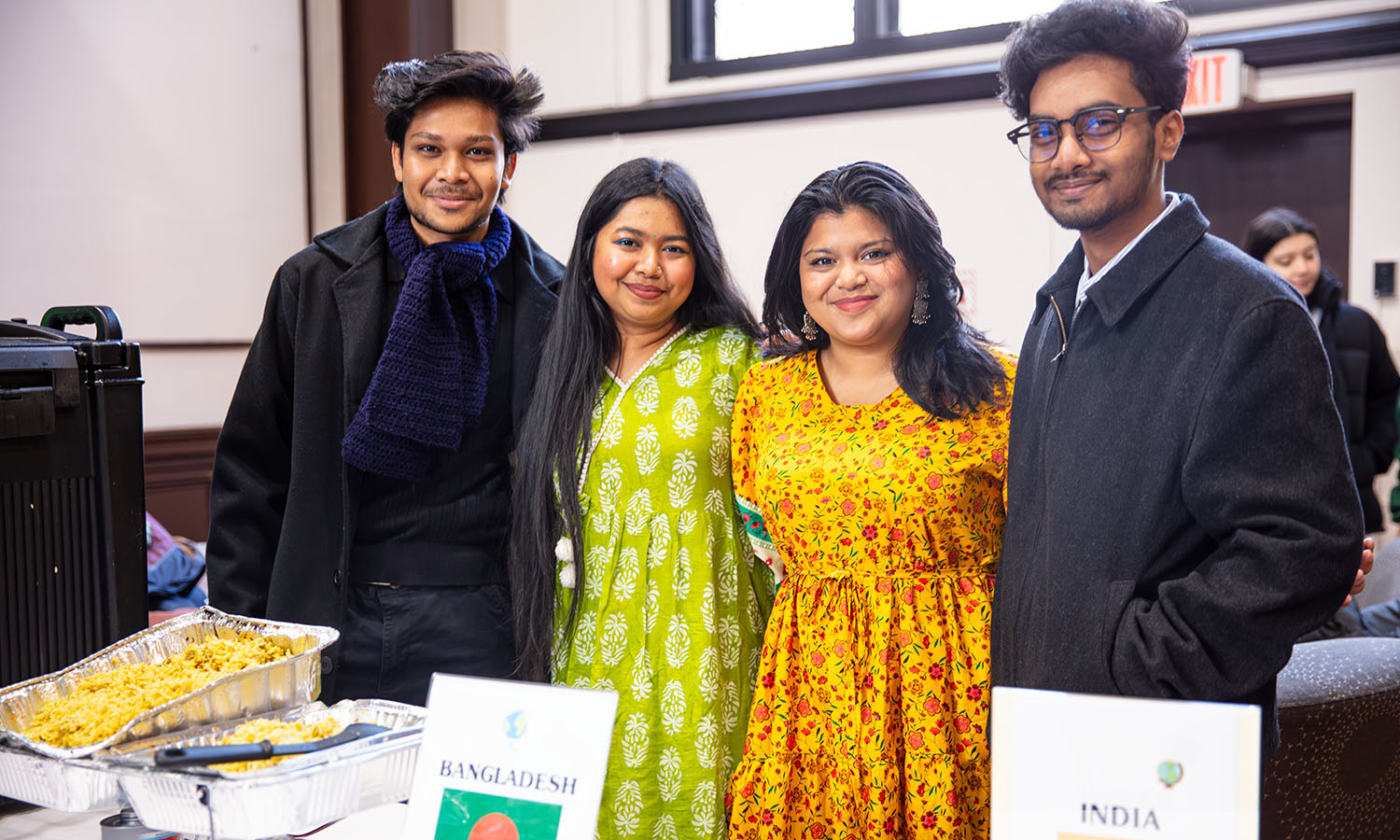 Students pose for a photo while attending the Taste of the World event in Bartlett Theatre, where students, faculty and staff experienced a variety of international foods and performances. 