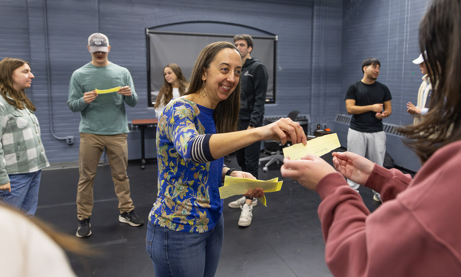 Professor of Theatre Chris Woodworth shares prompts with students for an improv exercise in "Acting One."  