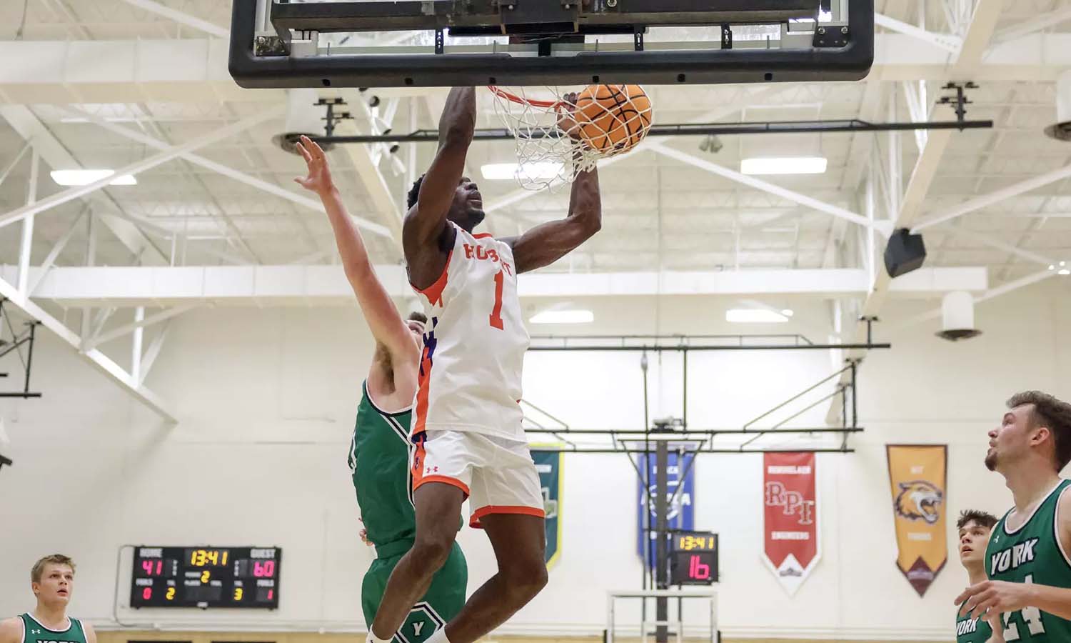 Dorian Paki ’27 throws down a dunk during the Hobart basketball team’s season opener against York on Nov. 7. Through two games, he’s averaging 13.5 points per game. 