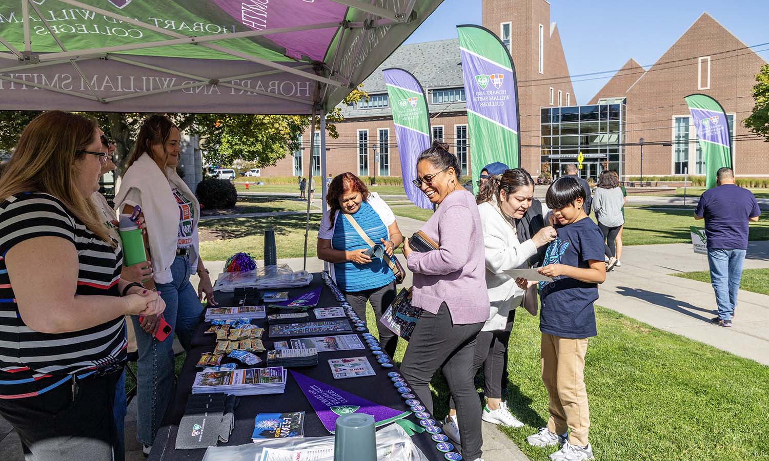 Families check in at the welcome tent for Homecoming and Family Weekend. 