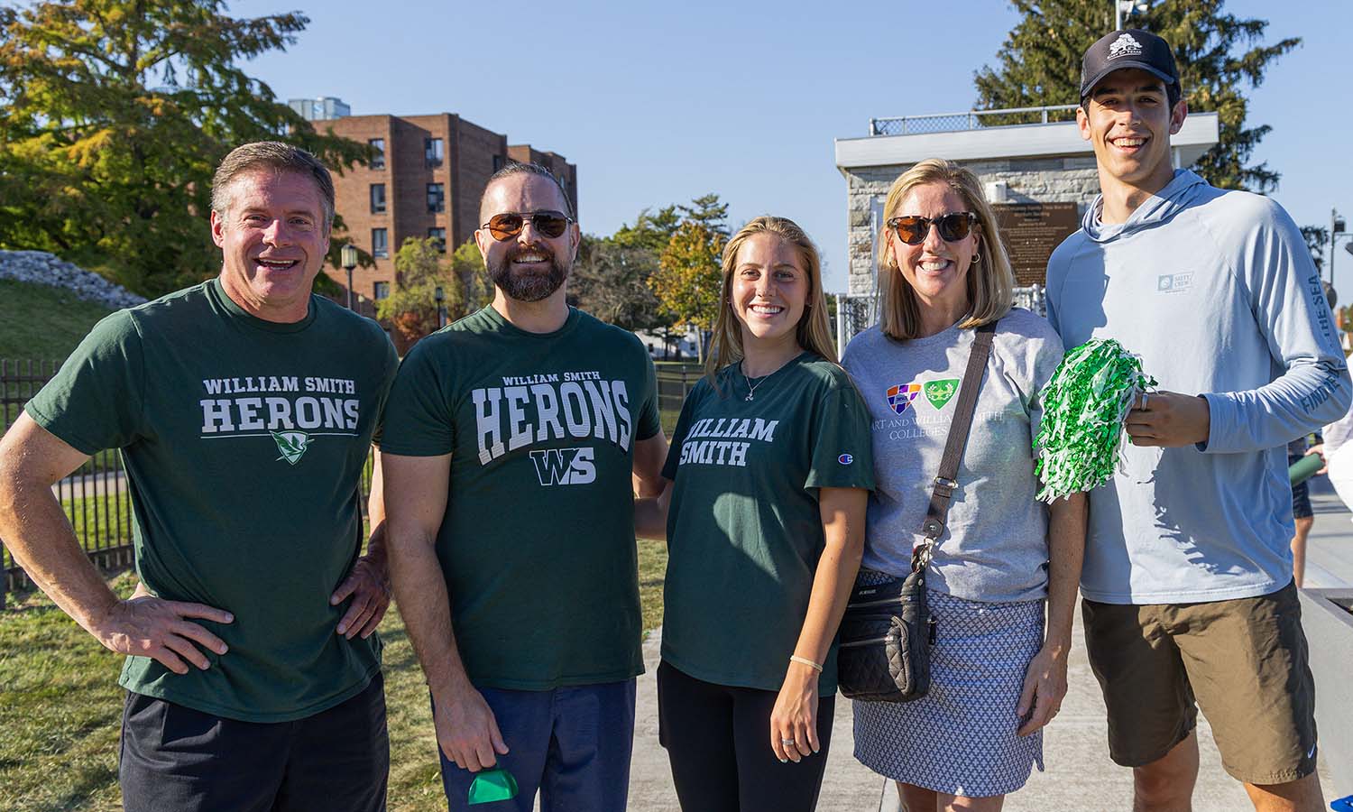 Families and students pose for a photo while cheering on the William Smith soccer team on Saturday. 