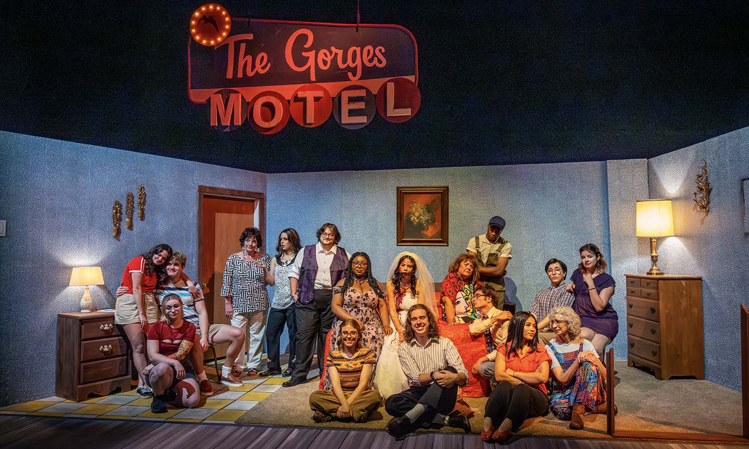 In McDonald Theatre, the cast of “The Gorges Motel,” directed by Professor of Theatre Chris Woodworth, pose for a photo after the show. 
