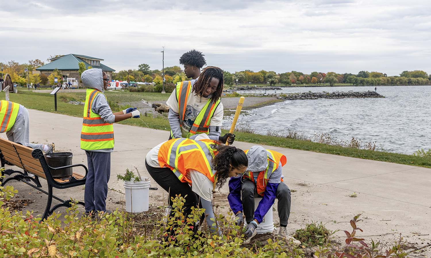 During the annual fall Day of Service, students tend the gardens at the Geneva Lakefront Park. 