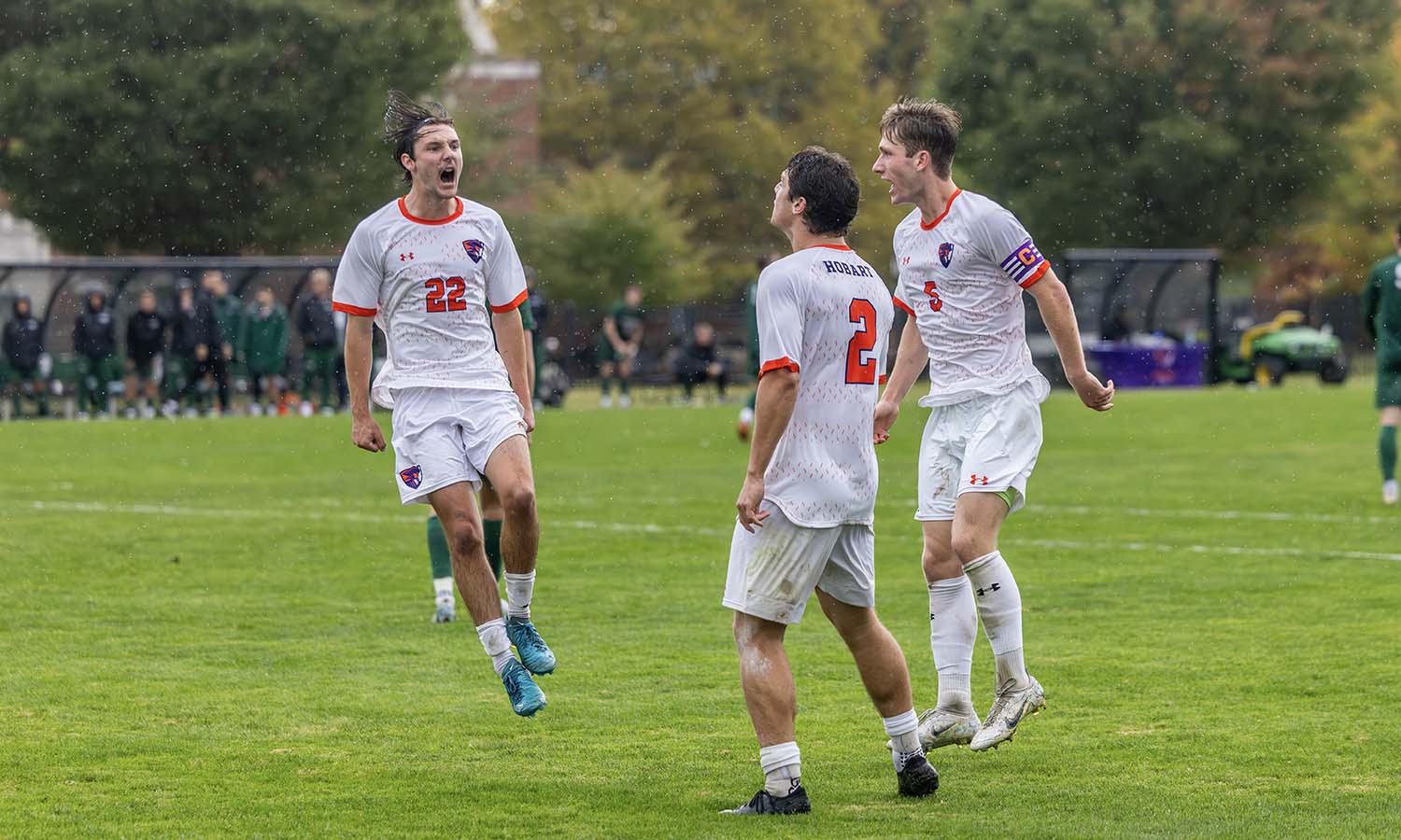 Quinn Phillips ’25, Steven Pickering ’25 and Griffin Coutts ’28 celebrate Coutts’ goal in Hobart soccer’s 2-1 win over Skidmore. 