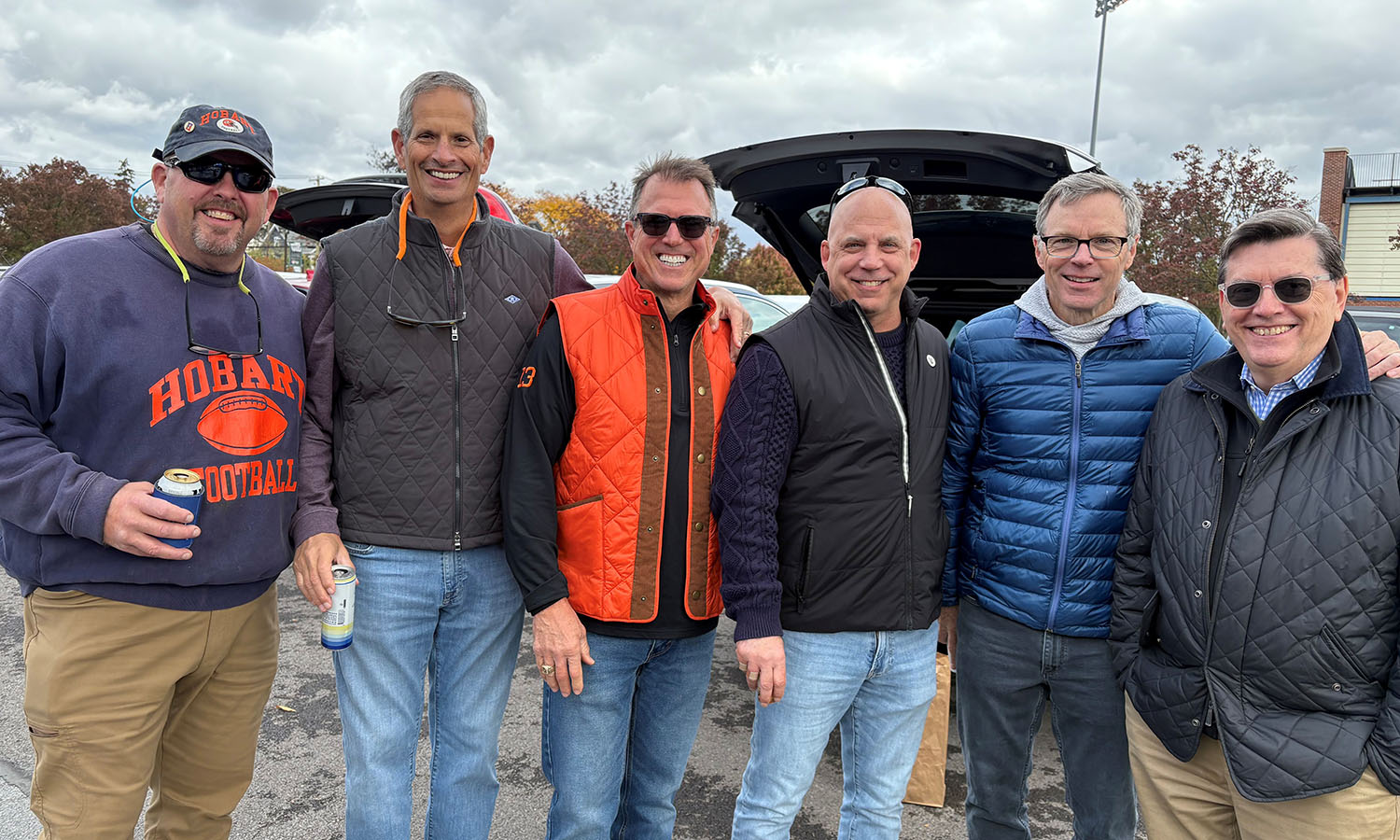 Alumni gather in advance of Hobart football’s 49-17 win over St. Lawrence on Saturday. Pictured are: Louis Cosentino ’87, David Jewell ’86, Thomas Rosa ’86, Todd Battaglia ’86, Chair of the Board of Trustees Joseph C. Stein III '86 and President Mark D. Gearan. 