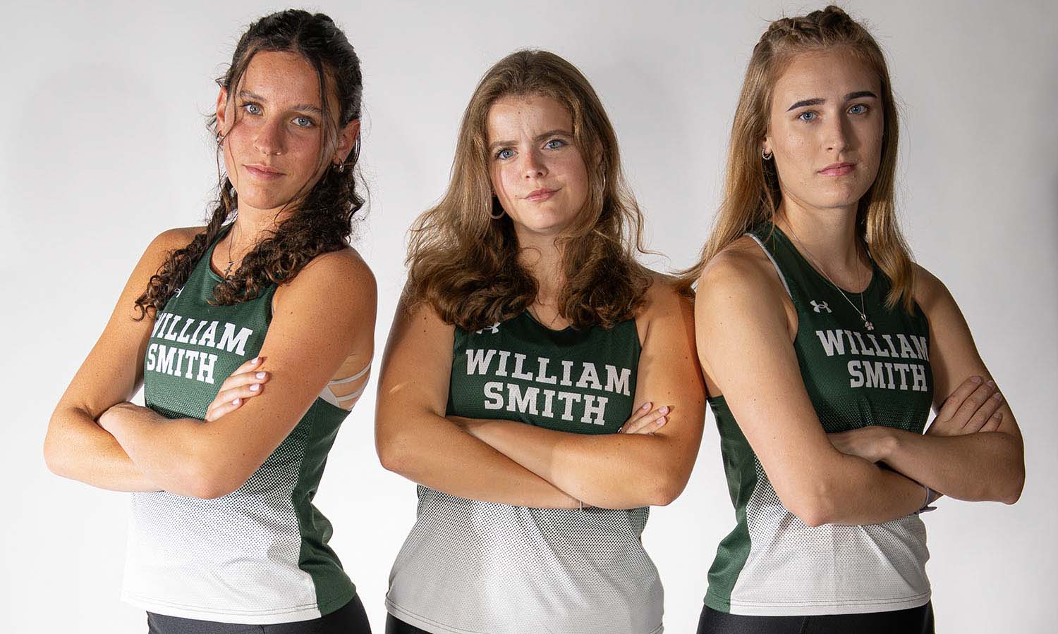 During William Smith cross country’s media day, Hope Johnson ’26, Lillian Morrell ’26 and Talya Peterson ’26 pose for a photo. 