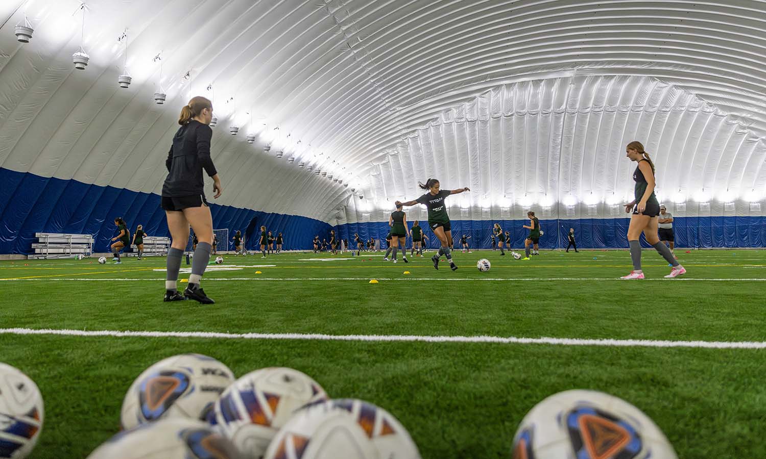 Julia Accioly ’26 participates in a passing drill during a Wiliam Smith Soccer practice inside the Poole Family Dome. 