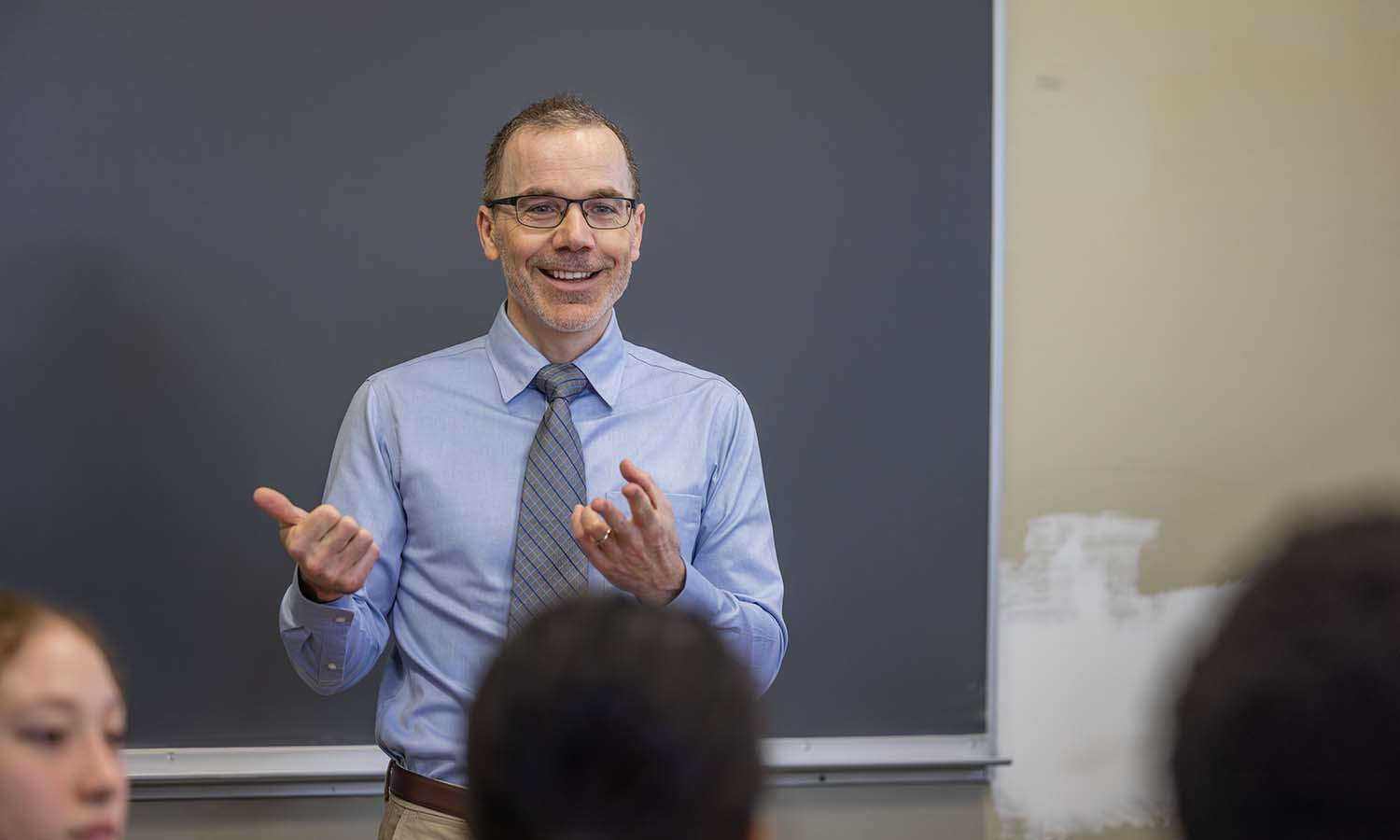 Professor of German Area Studies Eric Klaus greets students at the start of class during “Berlin: Yesterday Today Tomorrow.” 
