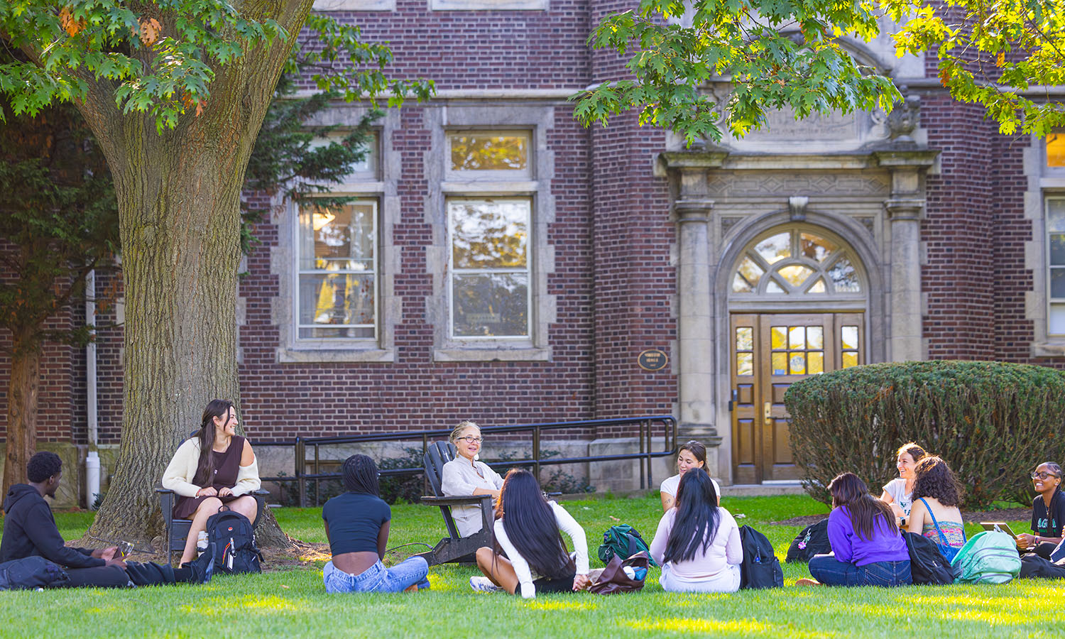 Instructor of Spanish, Latin American and Bilingual Studies Alejandra Molina leads a book discussion on Smith Hall lawn for her course "Latina Writing in the United States." 