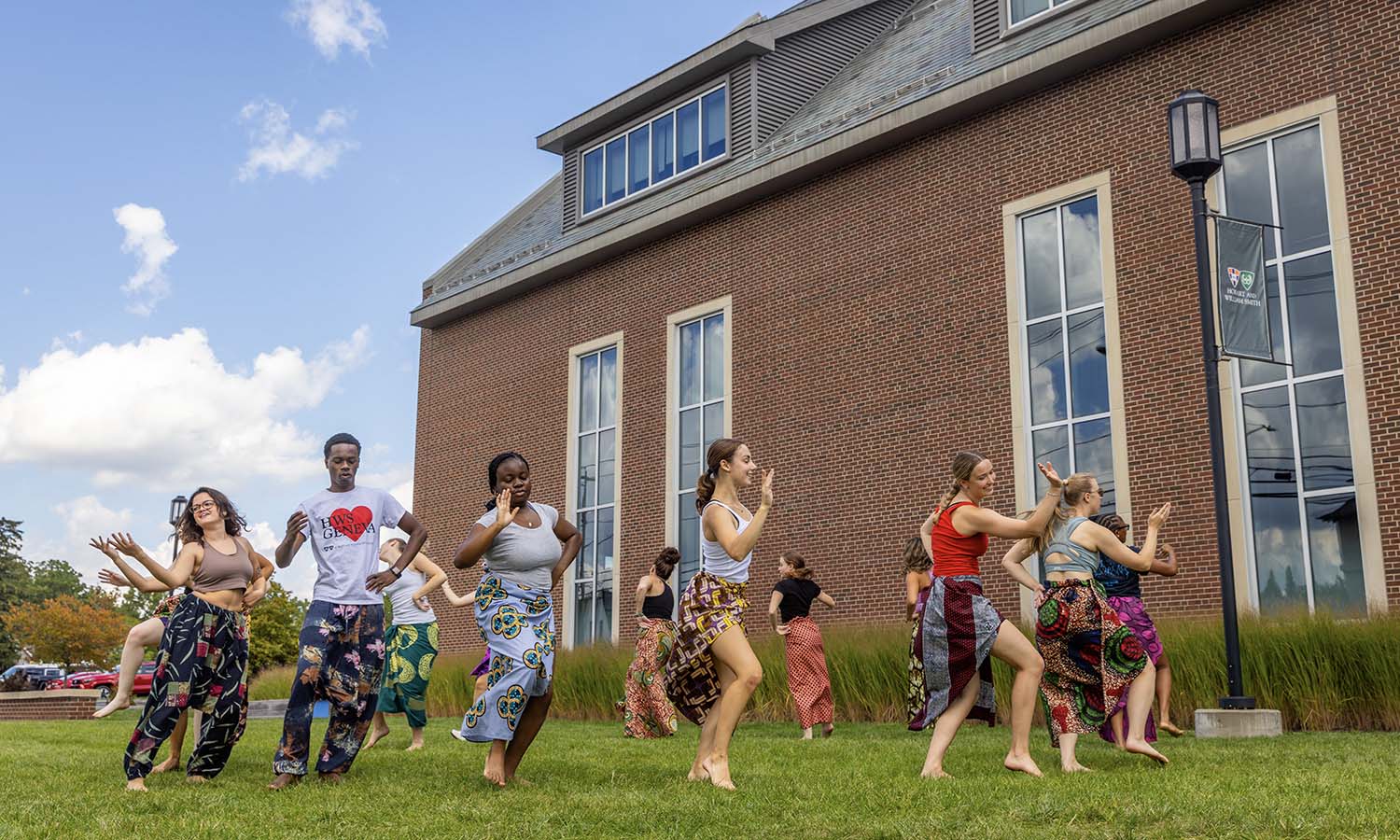 During “Dances of the African Diaspora II” with Associate Professor of Dance and Movement Studies Kelly Johnson, students learn Sinte outside the Gearan Center for Performing Arts. 