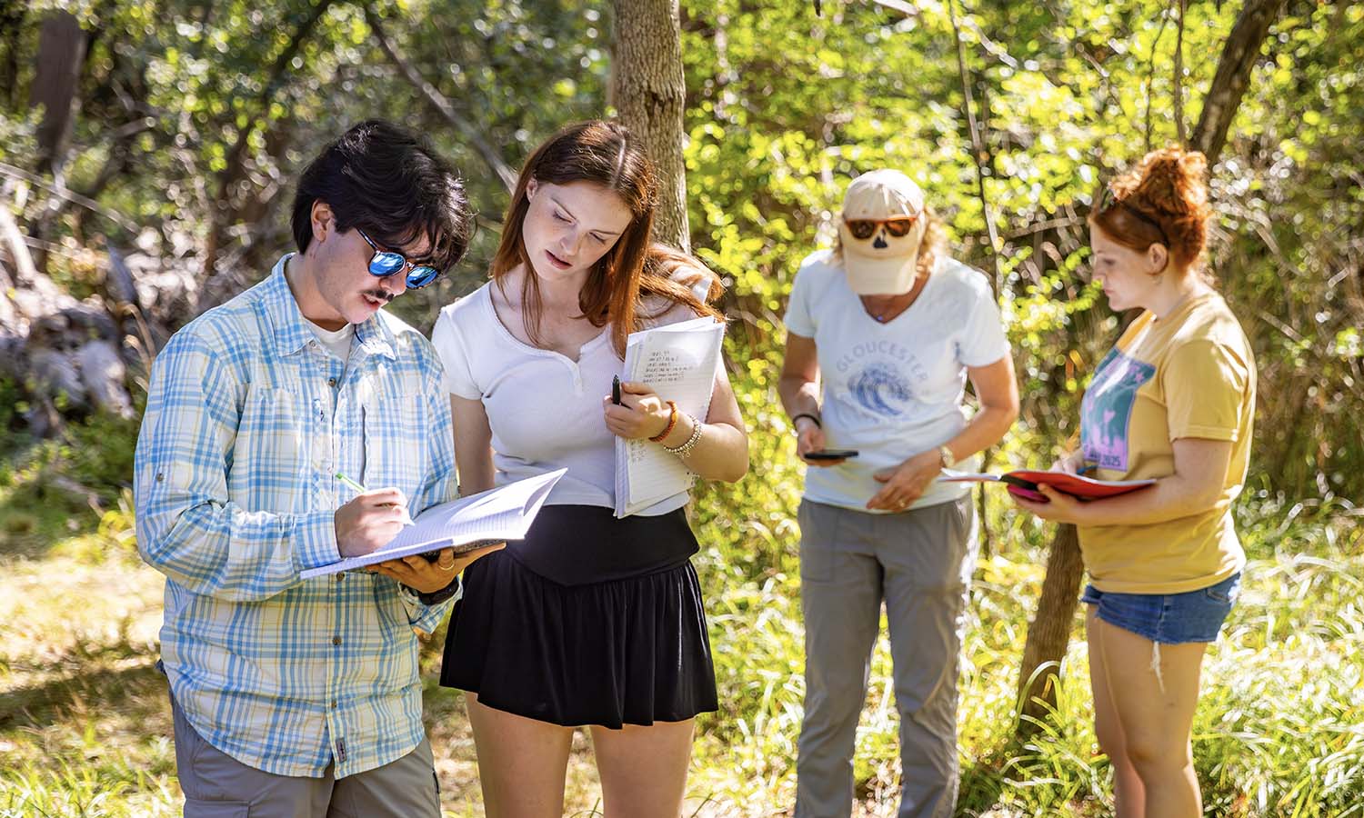 While conducting a field study on disturbance ecology at Coopers’ Woods, Associate Professor of Practice Susan Cushman '98 joins Jonah Friedman ’26, Maddy Buck ’26 and Alex Miller ’27 to collect data on soil conditions and invertebrate diversity in pitfall traps during “Global Change Biology.” 