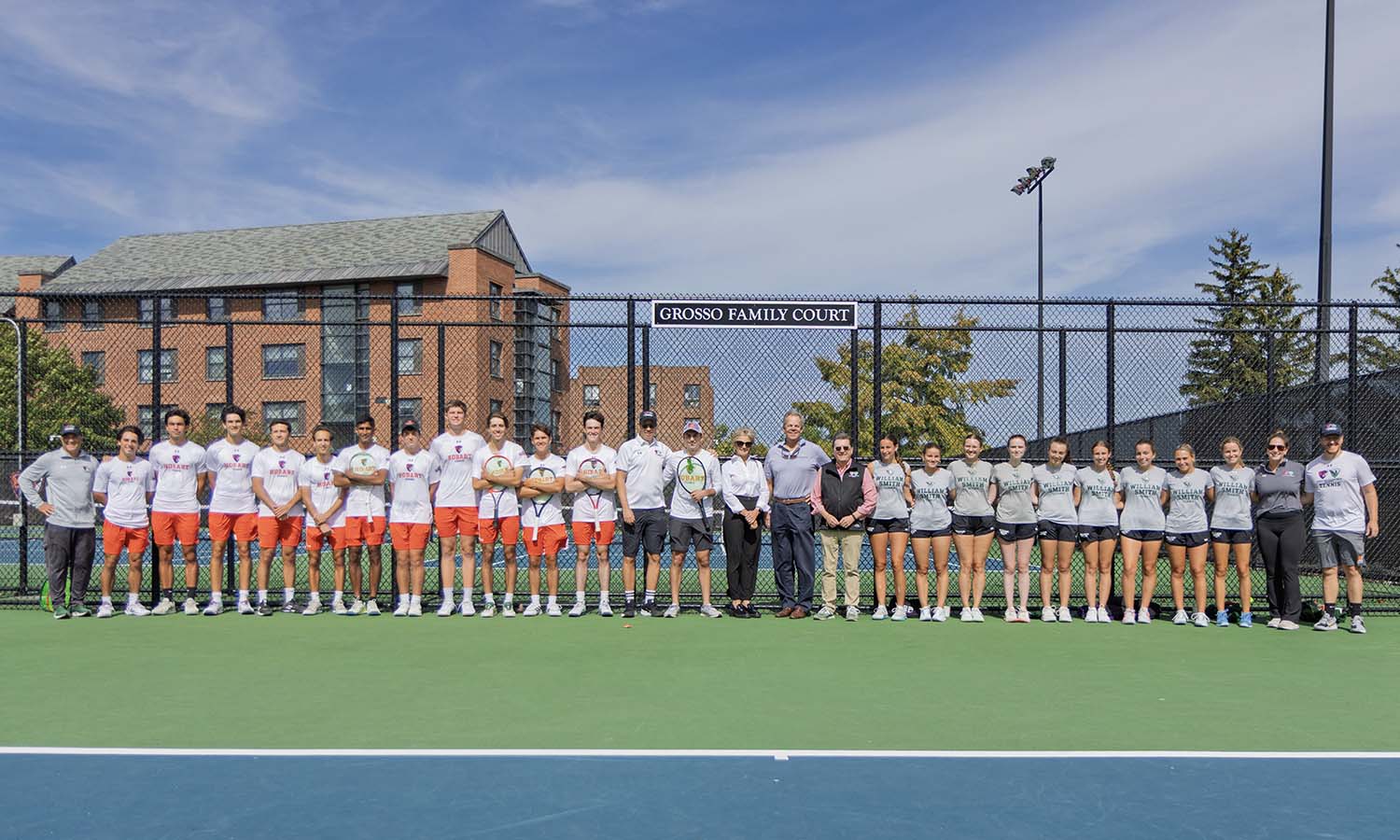 The HWS tennis teams are joined by Nick Grosso ’25, Kristin and Christopher Grosso P’25 and President Mark D. Gearan for the unveiling of the Grosso Family Court during the Fall Community Tennis Day. the Fall Community Tennis Day. 