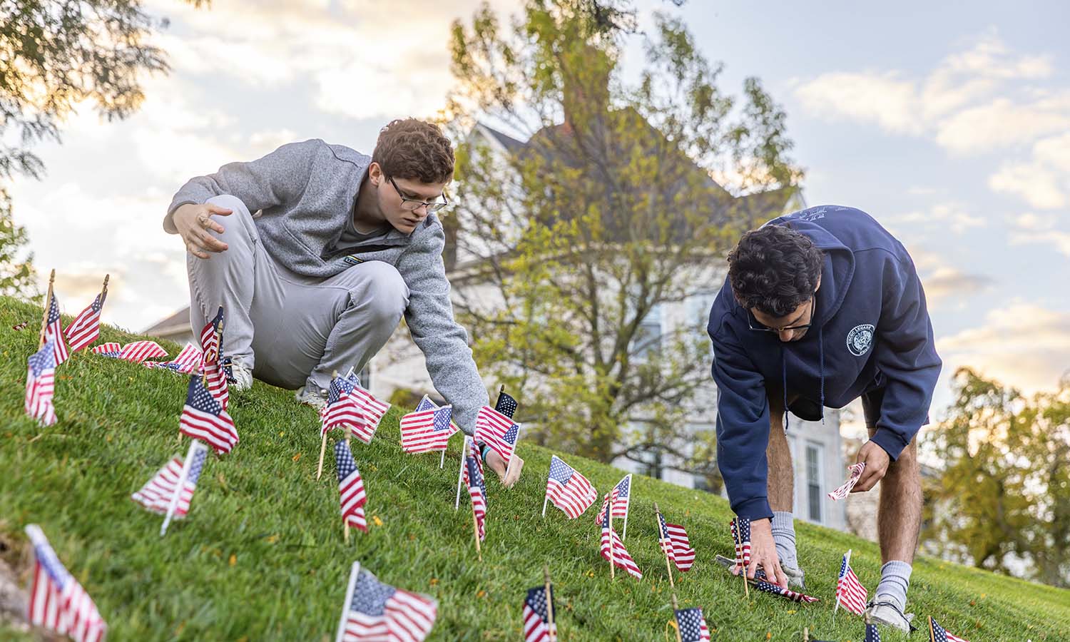 Members of Kappa Alpha fraternity place flags on the Quad in remembrance of the lives lost during the attacks on Sept. 11, 2001. 