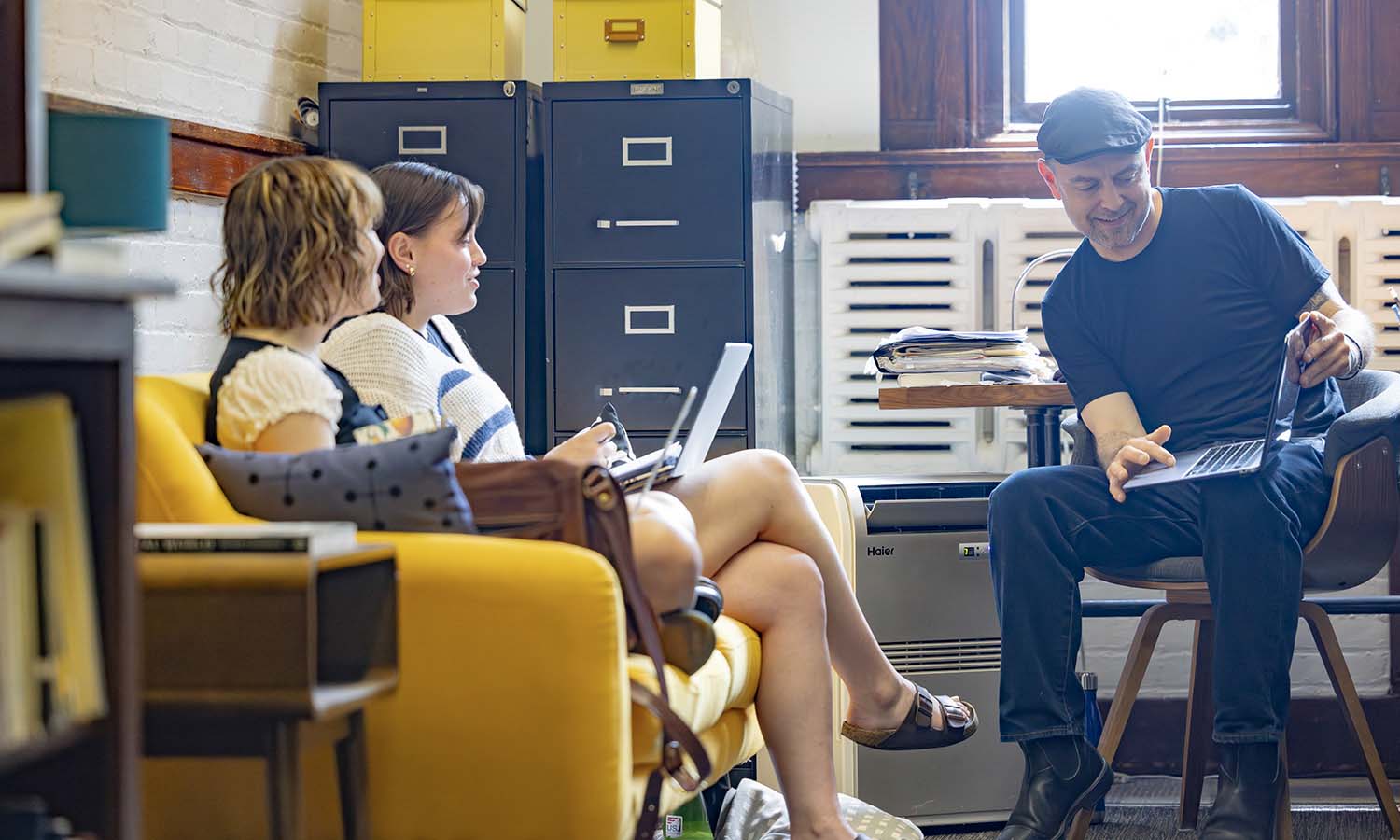 Summer Scholarship Fellows Laura Thérien ’26 and Hazel Brown ’28 work on the Seneca Review with Editor-in-Chief and Associate Professor of Writing and Rhetoric and English and Creative Writing Geoffrey Babbitt. 
