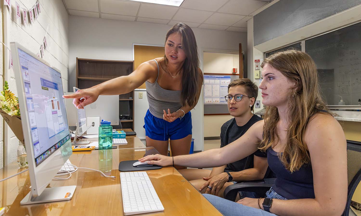 Under the direction of Assistant Professor of Chemistry Matthew Church ’14, Maryfei Berrigan ‘27, Toni Goerke ’27 and Aubrey Ryan ‘26 are using supercomputers and advanced scientific methods to simulate ultrafast chemical reactions, gaining insight into otherwise unmeasurable processes. 