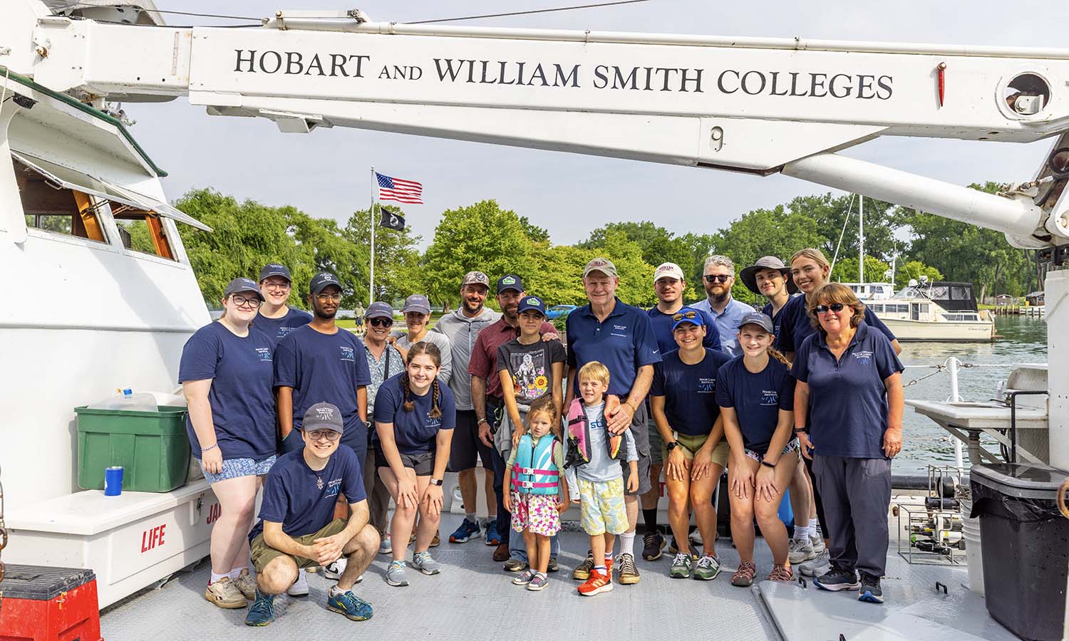 Before heading out on Seneca Lake to study water quality and food webs, Daniel R. Baker ’72 and his family join Finger Lakes Institute research students, Director Lisa Cleckner, Associate Director Sam Beck-Andersen and Lab Manager Trevor Massey for a photo aboard the William Scandling. 