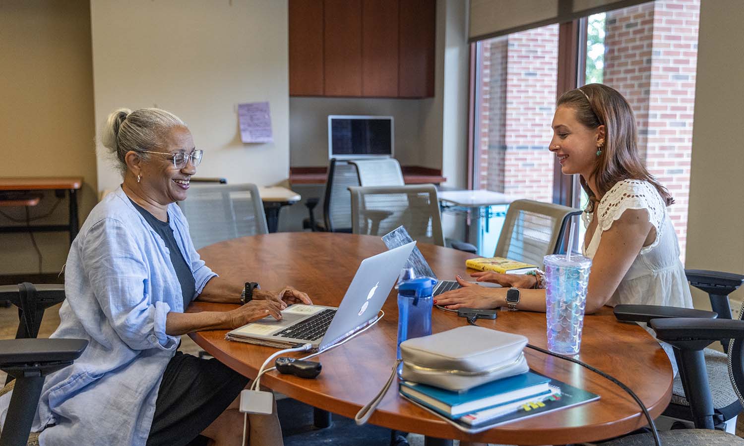 Associate Professor of History Janette Gayle and Alexandra Dickinson ‘27 examine the Mapping Harlem Digital Project, studying settlement patterns and neighborhood formation in Harlem, with a focus on Black self-employed dressmakers from 1900-1920. 