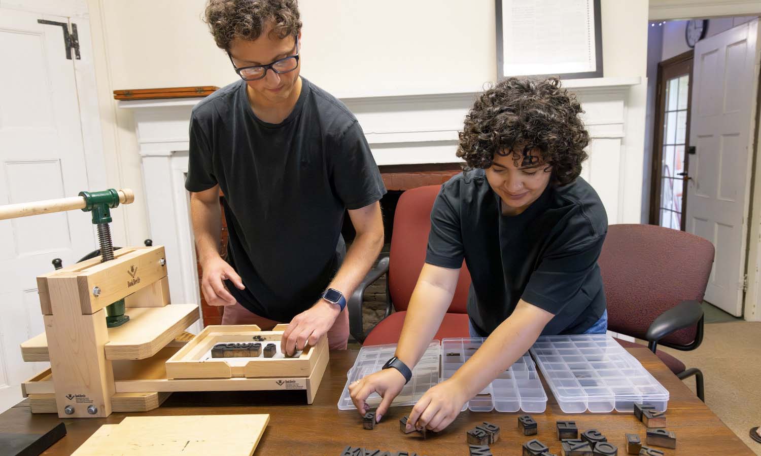 With funding from the Mellon Foundation and under the direction of Professor of History Matthew Crow, Connor Gasper ‘26 and Alyssa Hanuscin ‘27 examine a common press as part of the “Matters of Memory” summer research project. 