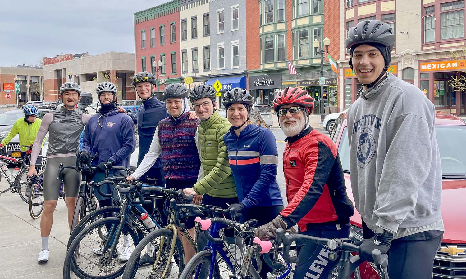 Senior Associate Director of Admissions Sue Willard ’99 and Professor of Philosophy Eric Barnes join students in the HWS Cycling Club for a photo before going for a ride around the Finger Lakes. 
