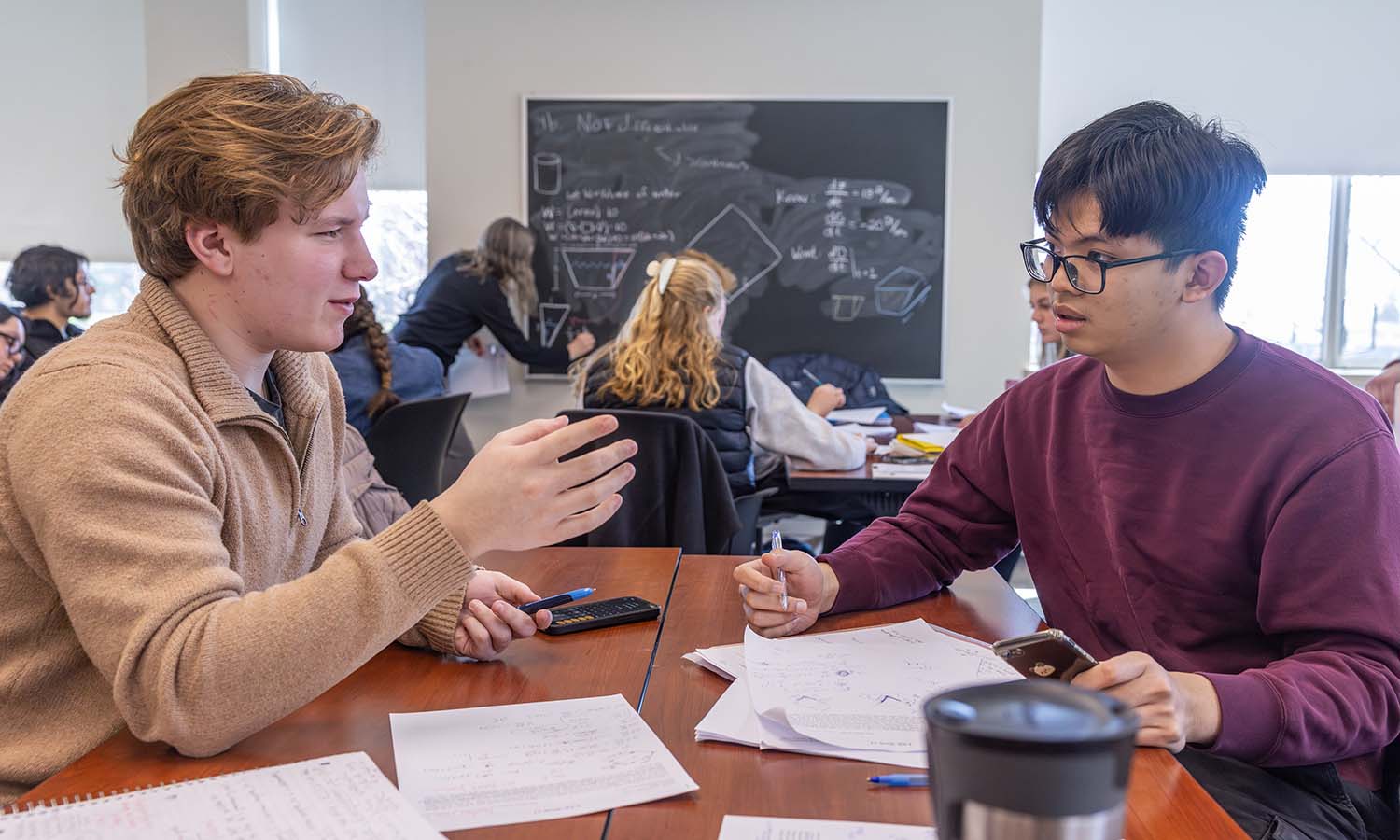 Nathan Jones ‘29 and Khanh Phan ‘29 work on a group activity during the lab for “Calculus I” with Associate Professor of Mathematics and Computer Science Erika King. 