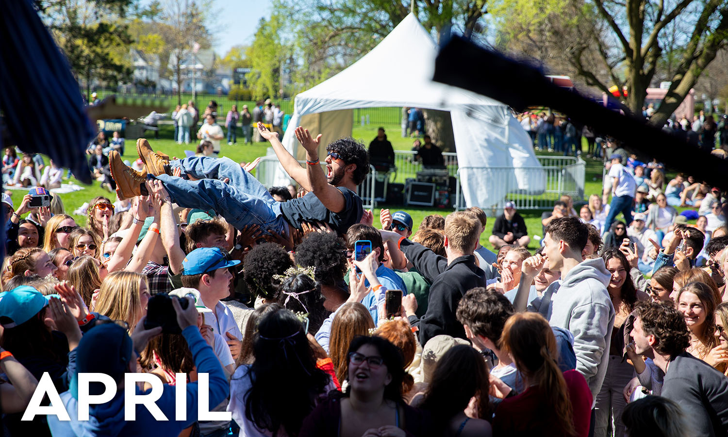 Nadir Khan ’27 crowd surfs during the Folk Fest concert held in April. Before more than 1,000 students, the indie rock band Arcy Drive headlined Folk Fest. HWS Student Government organized the revival of the cherished tradition held on campus from 1976-2001. 