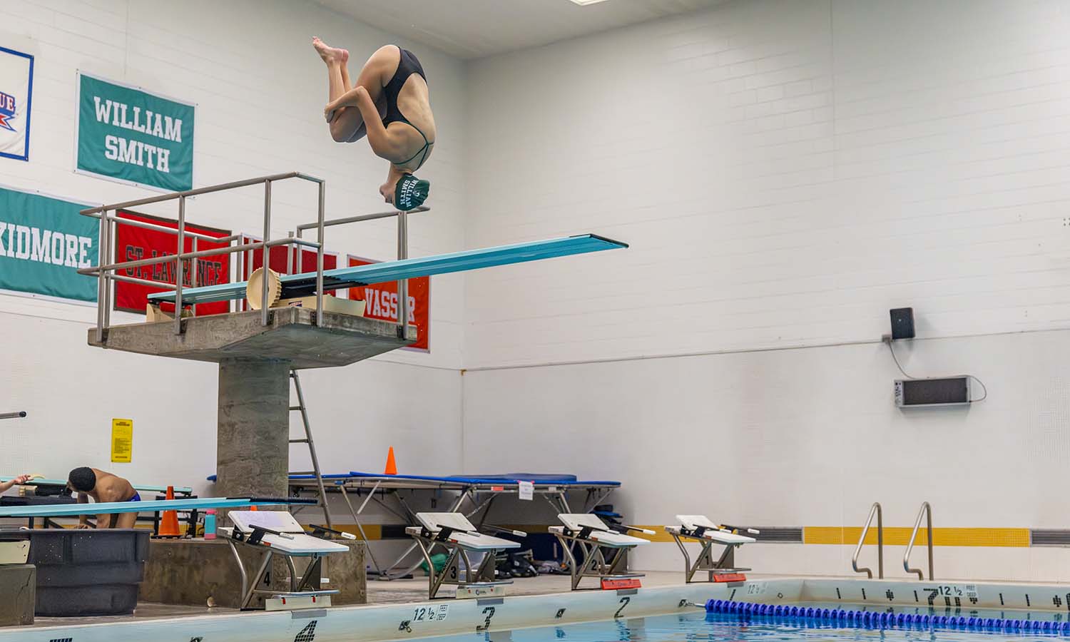 Fiona Garfield '28 performs a dive in Bristol Pool. 